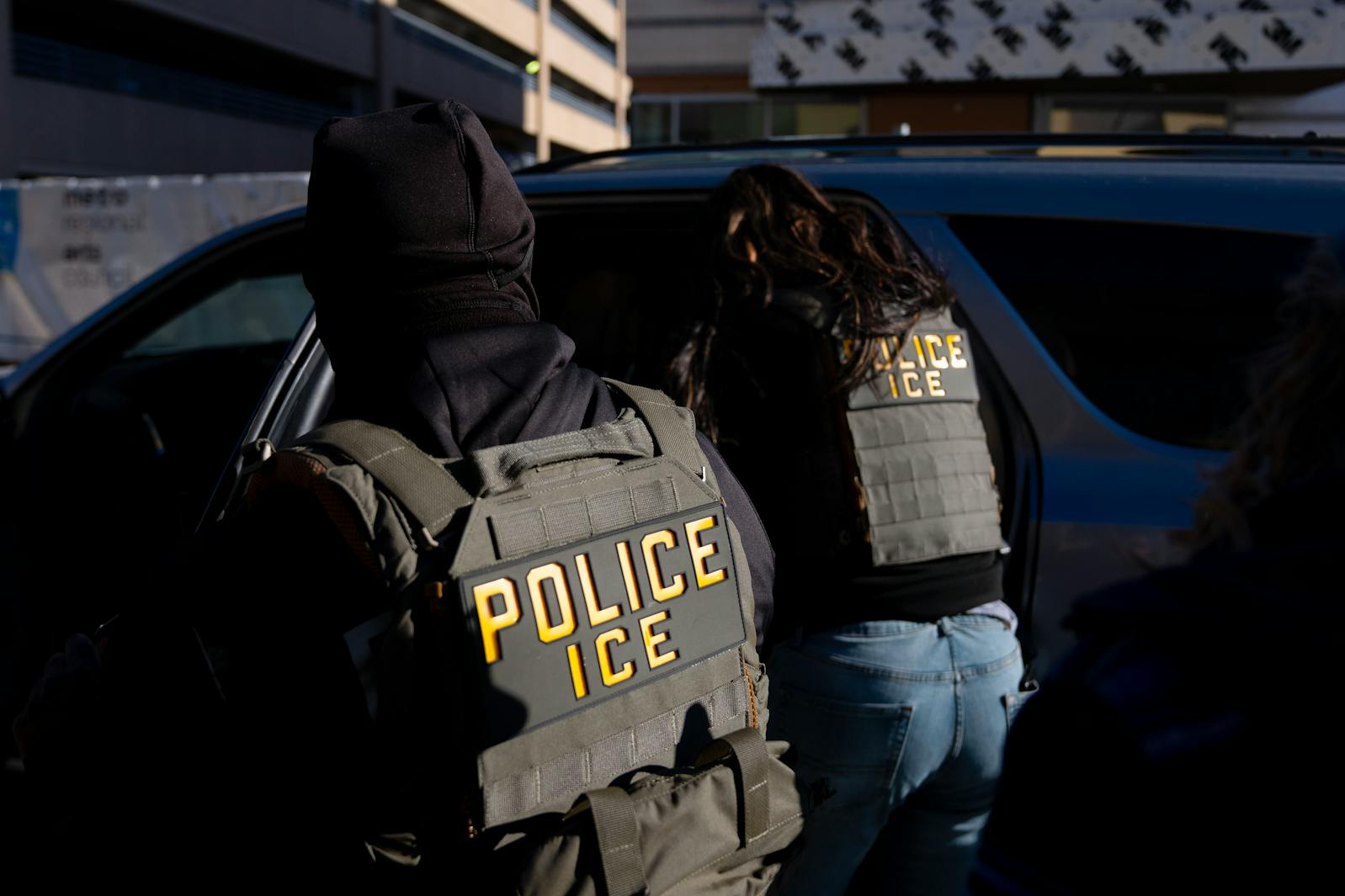 ICE agents detain a man from inside Midtown Global Market on Lake St. in Minneapolis on Wednesday, Jan. 14.