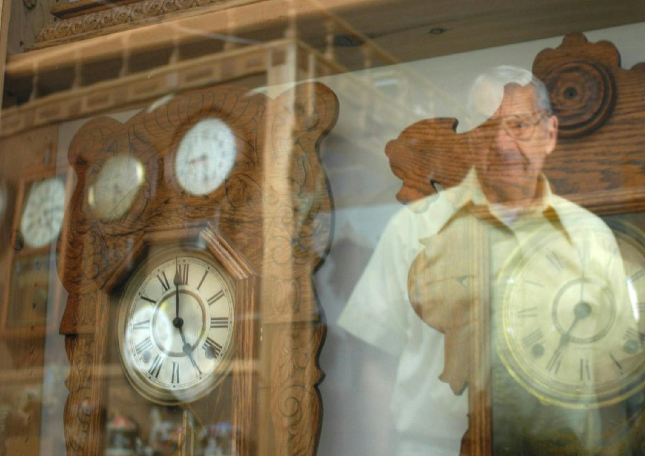 Tippi Thole/Star Tribune ? Jim Fiorentino collects, restores and preserves cuckoo clocks in his Minneapolis warehouse. Pictured in this display case (one of many he built that line the perimeter of his warehouse) are pre-1900 American gingerbread cuckoo clocks. "I enjoy restoring lost stuff," Fiorentino said.