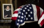 The flag-draped casket of Justice Ruth Bader Ginsburg lies in state in the U.S. Capitol on Friday, Sept. 25, 2020. Ginsburg died at the age of 87 on S