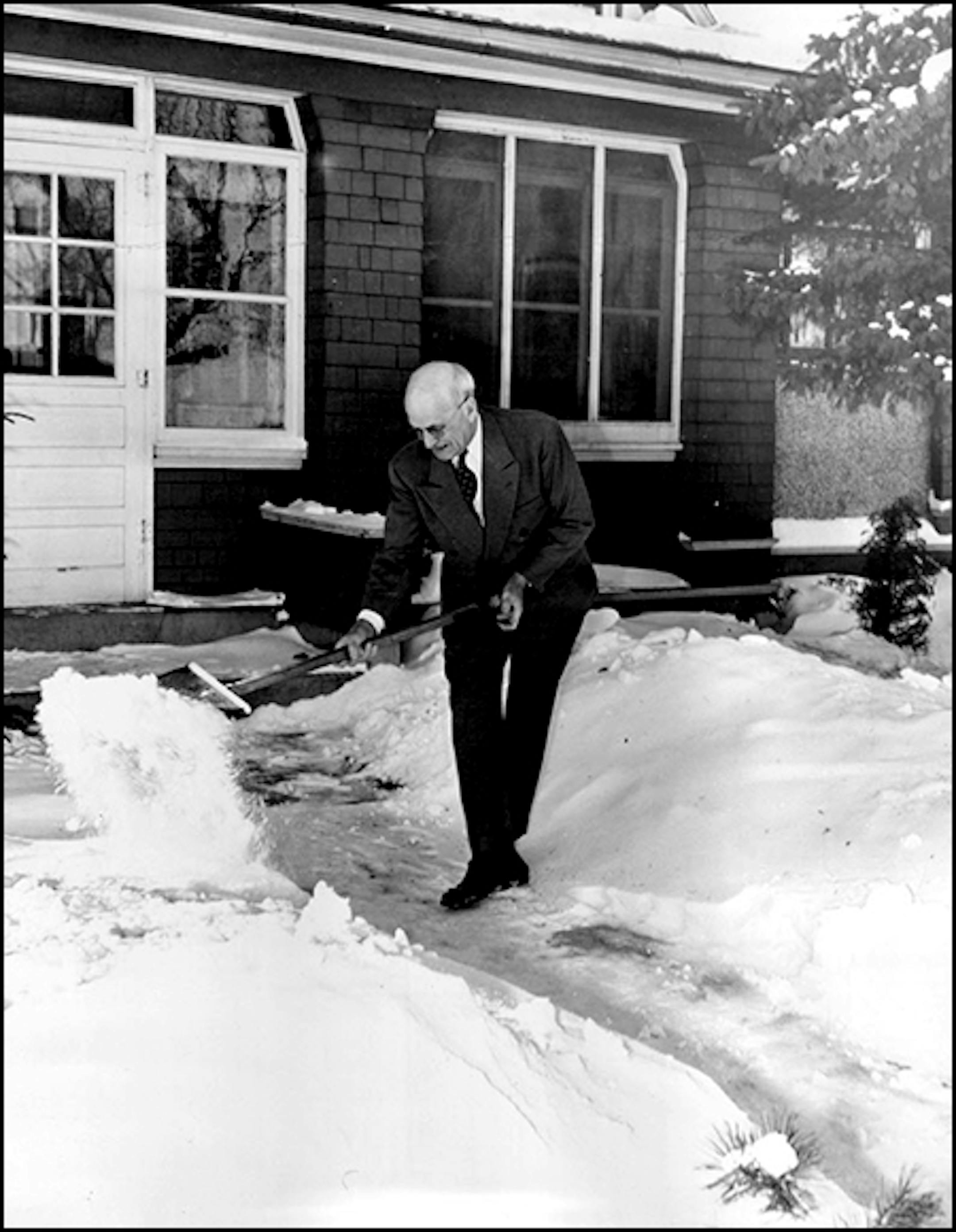 Dr. William Will shoveling, 1948