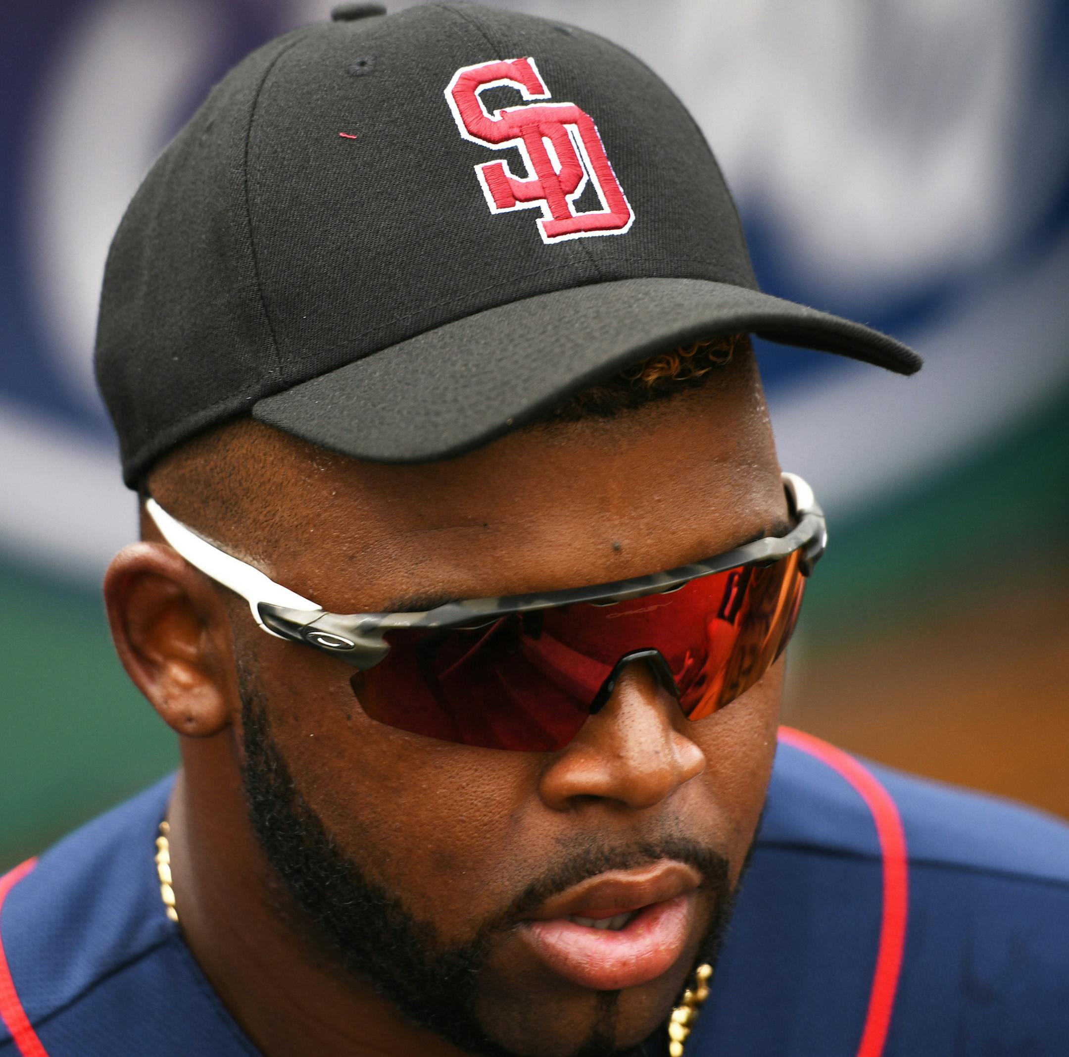 Twins first baseman Kennys Vargas (30) warmed up before Friday's game wile wearing a Marjory Stoneman Douglas High School baseball cap. Many MLB teams are following suit before their games this weekend in the wake of the mass shooting at the Florida school that left 17 people dead. ] MARK VANCLEAVE ï mark.vancleave@startribune.com * The Minnesota Twins played the Boston Red Sox at JetBlue Park in Fort Myers, Florida on Friday, Feb. 23, 2018.