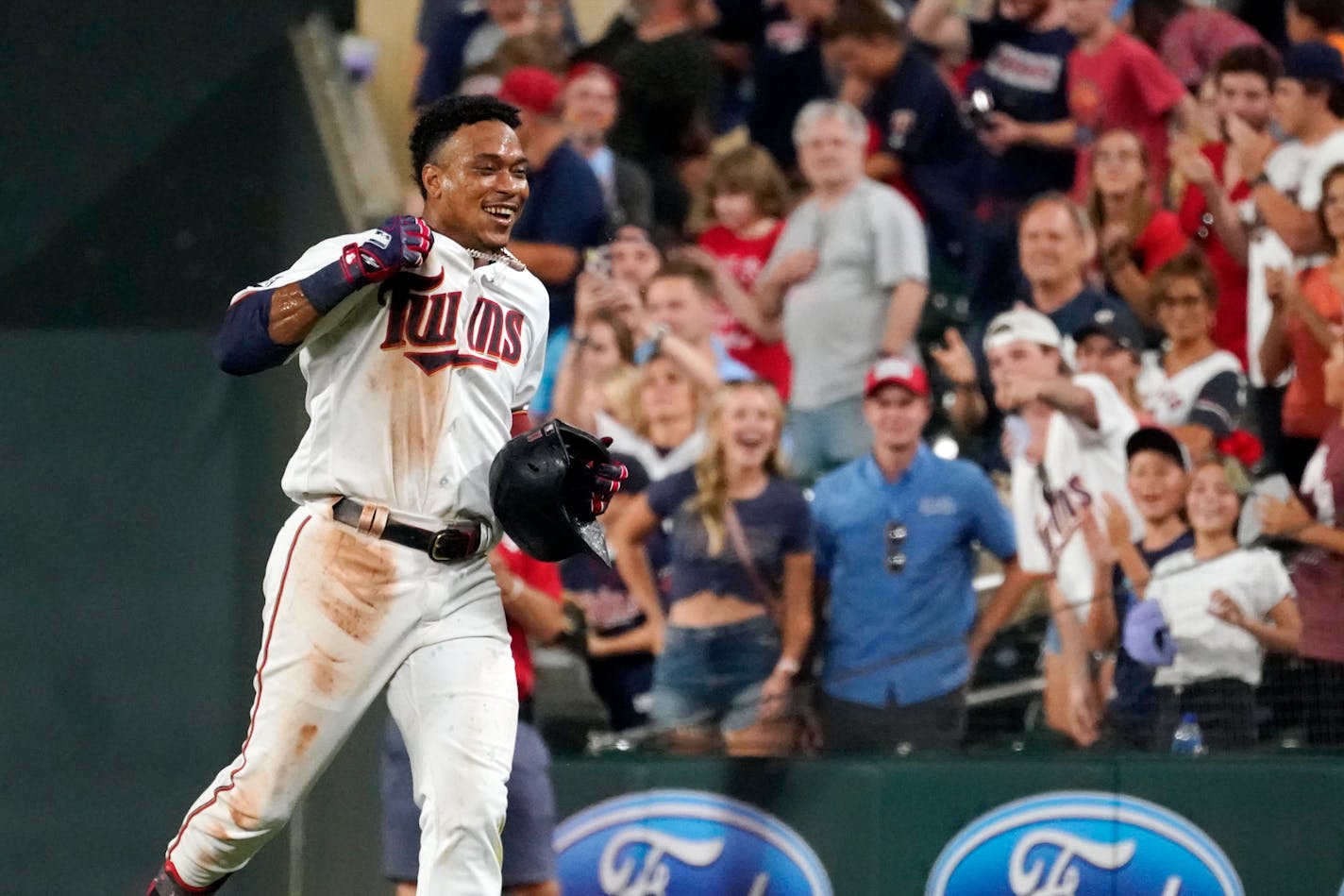 Minnesota Twins Jorge Polanco races to the dugout after his walk-off single drove in the winning run in the 10th inning of a baseball game against the Cleveland Indians, Monday, Aug. 16, 2021, in Minneapolis. The Twins won 5-4. (AP Photo/Jim Mone) ORG XMIT: MNJM111