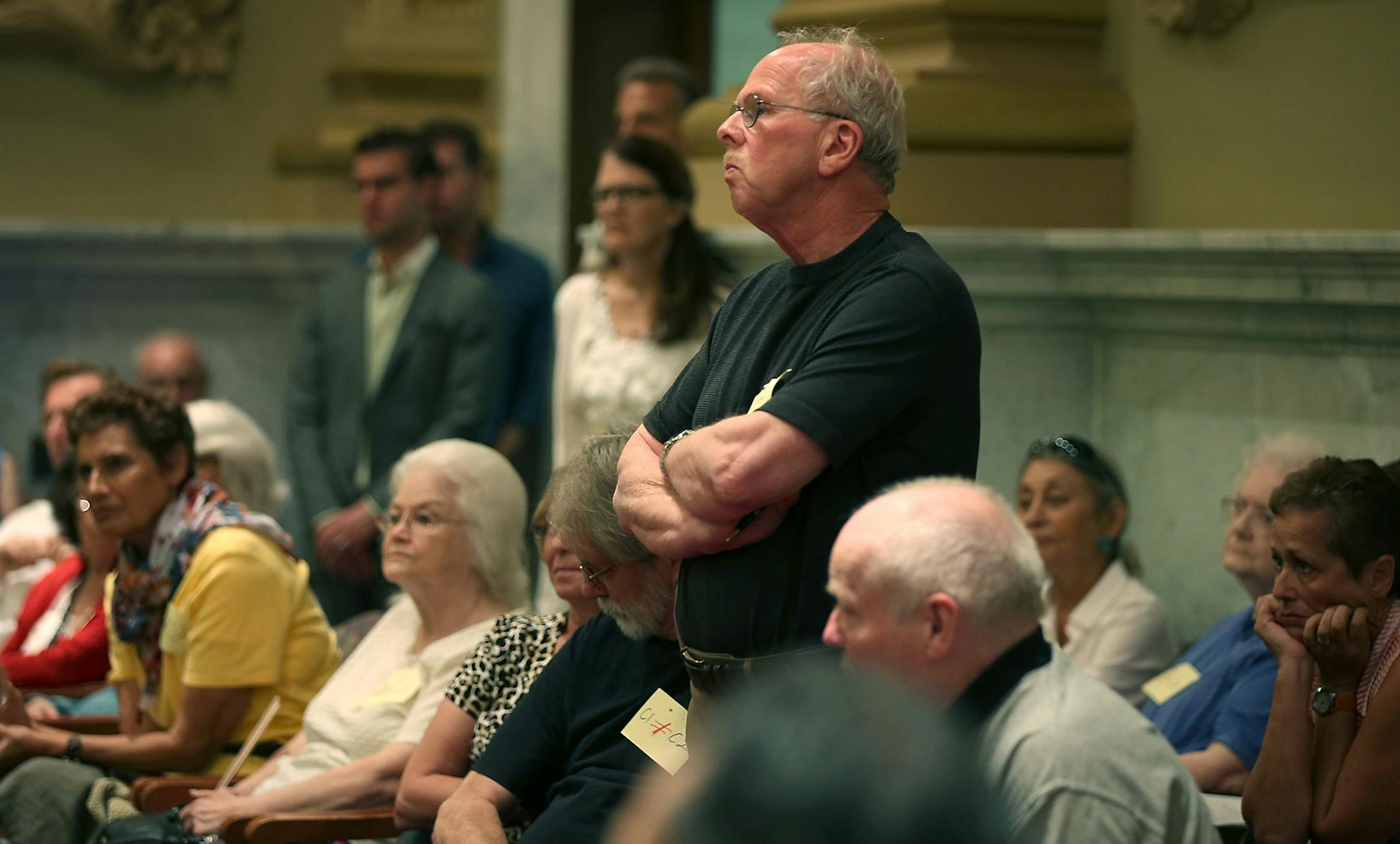 Linden Hills residents waited in line to express their opposition regarding the Linden Crossing proposal to the Zoning and Planning Committee, Thursday, August 7, 2014 at City Hall in Minneapolis, MN. ] (ELIZABETH FLORES/STAR TRIBUNE) ELIZABETH FLORES • eflores@startribune.com