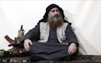 FILE - This file image made from video posted on a militant website April 29, 2019, purports to show the leader of the Islamic State group, Abu Bakr a