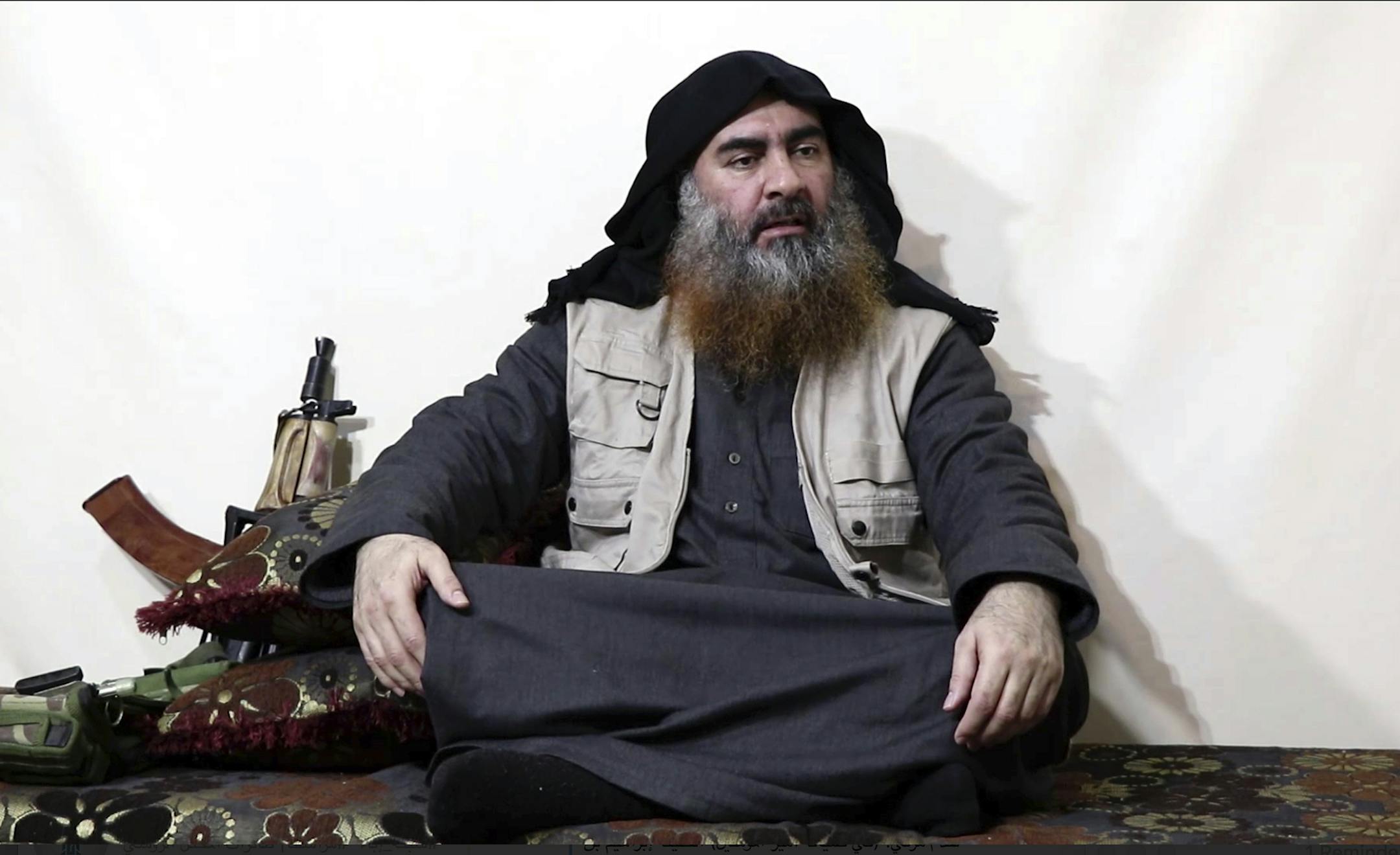 FILE - This file image made from video posted on a militant website April 29, 2019, purports to show the leader of the Islamic State group, Abu Bakr al-Baghdadi, being interviewed by his group's Al-Furqan media outlet. The IS erupted from the chaos of Syria and Iraq's conflicts and swiftly did what no Islamic militant group had done before, conquering a giant stretch of territory and declaring itself a "caliphate." U.S. officials said late Saturday, Oct. 26, 2019 that al-Baghdadi was the target