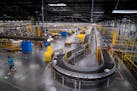 Shown is Amazon’s larger fulfillment center in Shakopee. The Brooklyn Park warehouse, though, smaller will rely on automation to help workers as the