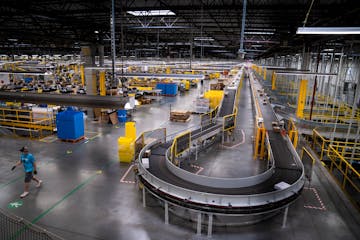 Shown is Amazon’s larger fulfillment center in Shakopee. The Brooklyn Park warehouse, though, smaller will rely on automation to help workers as the