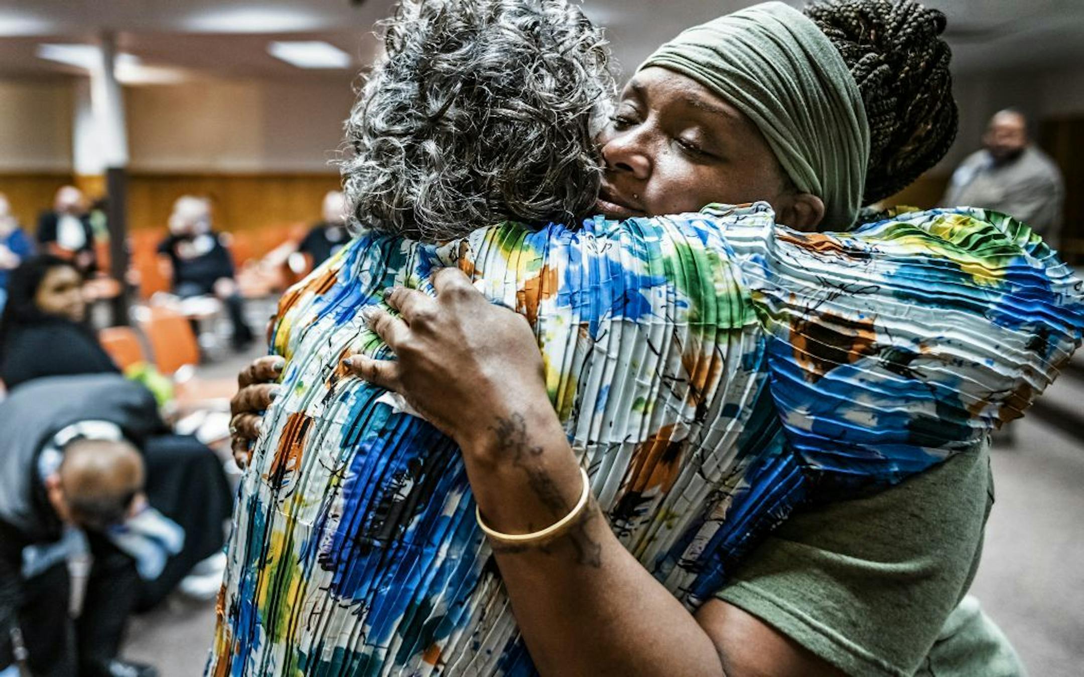 Mary Johnson-Roy gave a hug to Pastor Marea Perry, who spoke about the pain of losing her son . Both women have lost their sons to homicide.