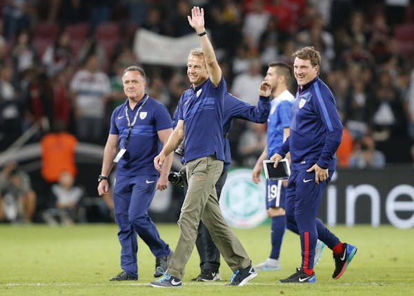 United States' head coach Juergen Klinsmann waves as he leaves the pitch