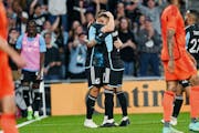 Minnesota United players celebrate their first and only goal in the second half of the game against Houston Dynamo at Allianz Field on Saturday, April
