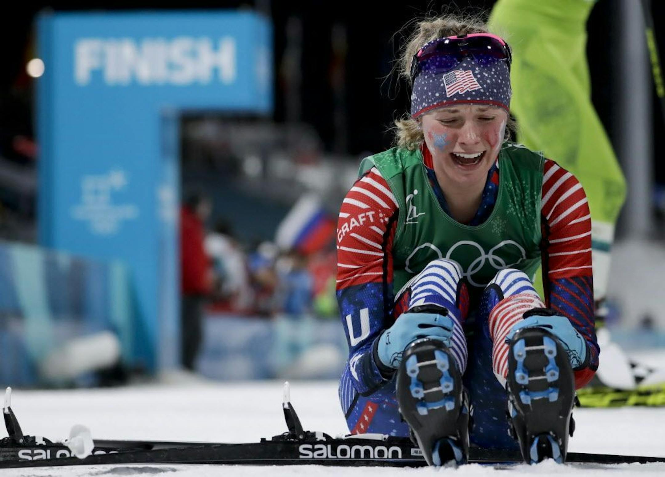 Jessie Diggins, of the United States, celebrates after winning the gold medal in the during women's team sprint freestyle cross-country skiing final at the 2018 Winter Olympics.