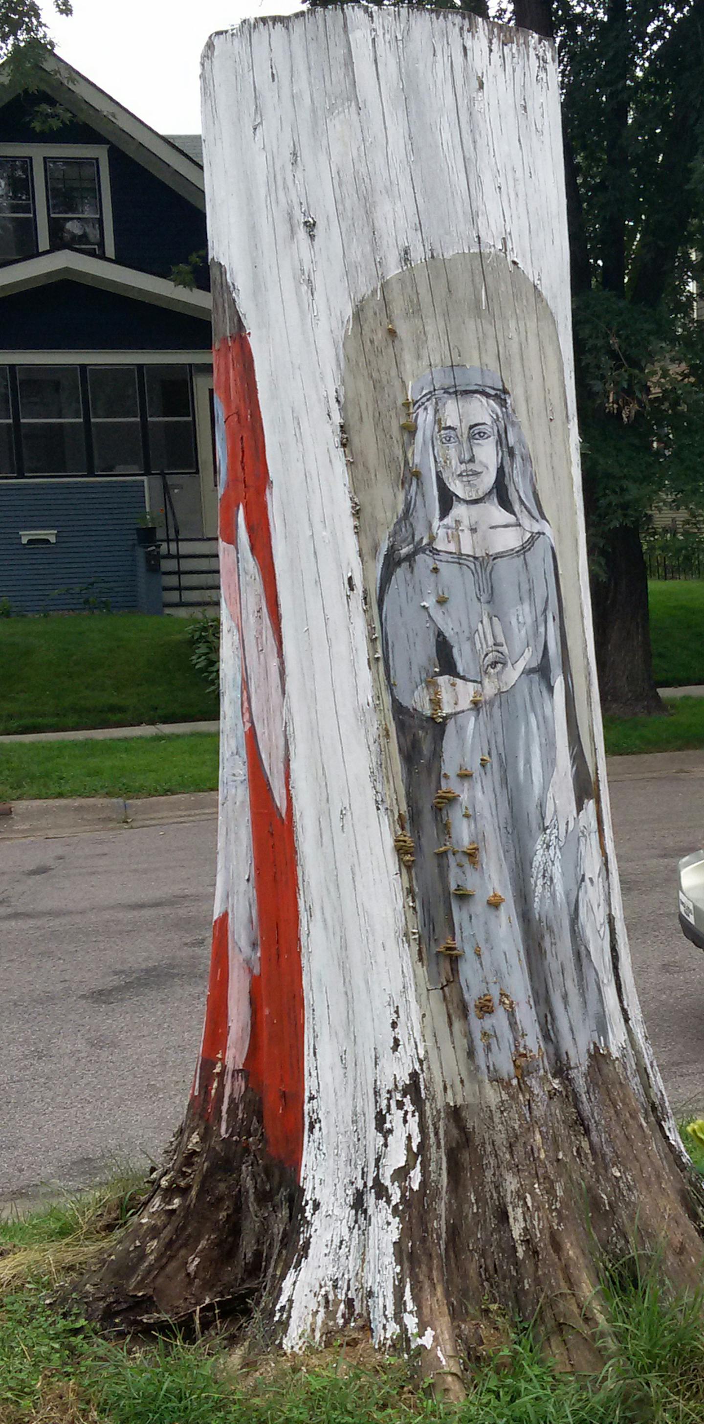 Hend Al-Mansour had three figures painted on the tree trunk that once stood in front of her home in the Union Park area of St. Paul, including one that upheld the Hand of Fatima to dispel the evil eye.]RichardTsong-Taatarii richard.tsong-taatarii@startribune.com