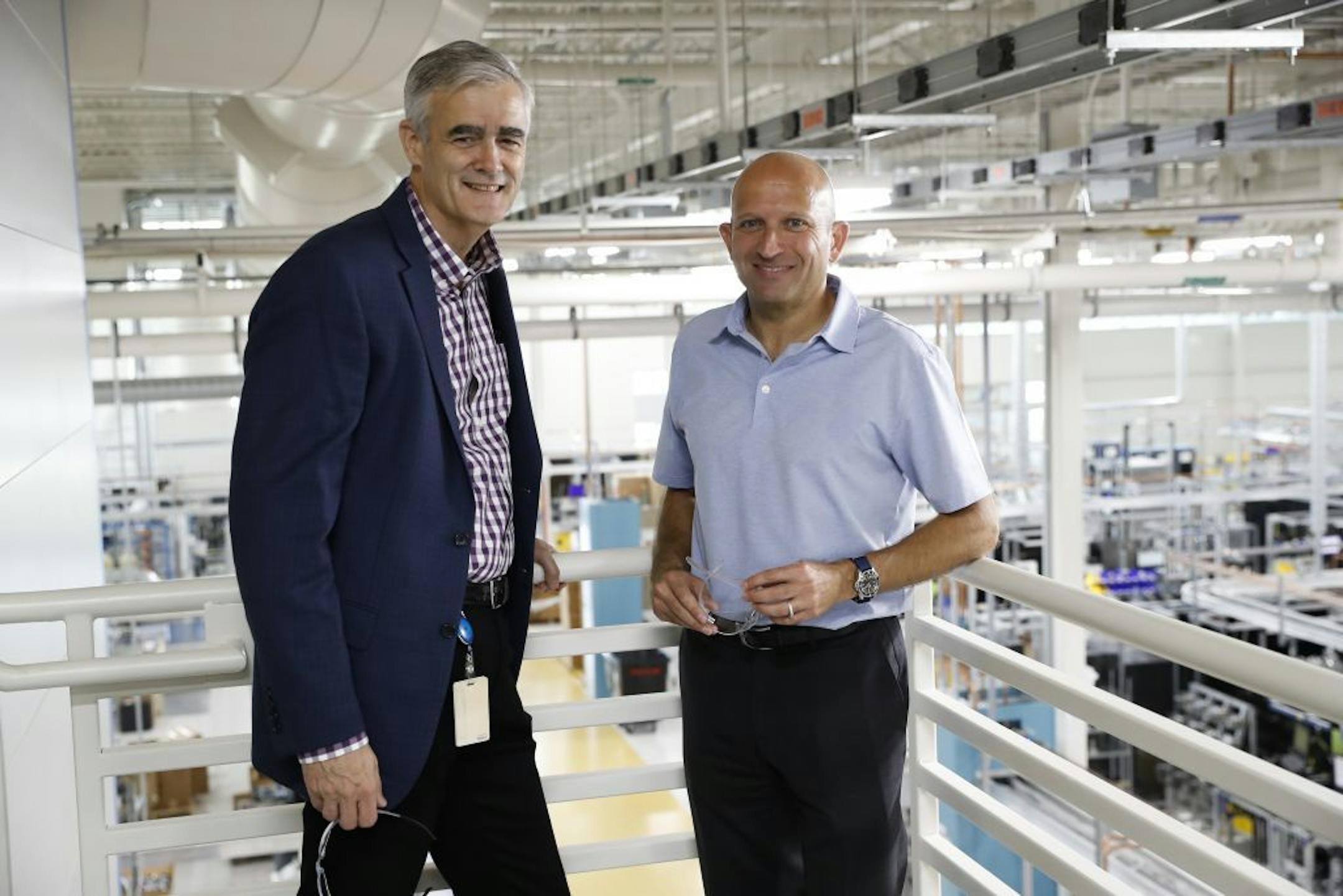 Emerson Automation Solutions executive president Mike Train and group president Lal Karsanbhai posed for a photo above the manufacturing floor at Emerson Automation Solutions on Friday, September 15, 2017, in Shakopee, Minn.