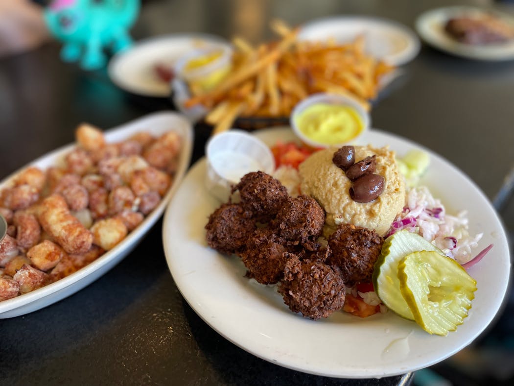 Foxy Falafel’s signature dish and dilly fresh cheese curds are still a hit ten years later.