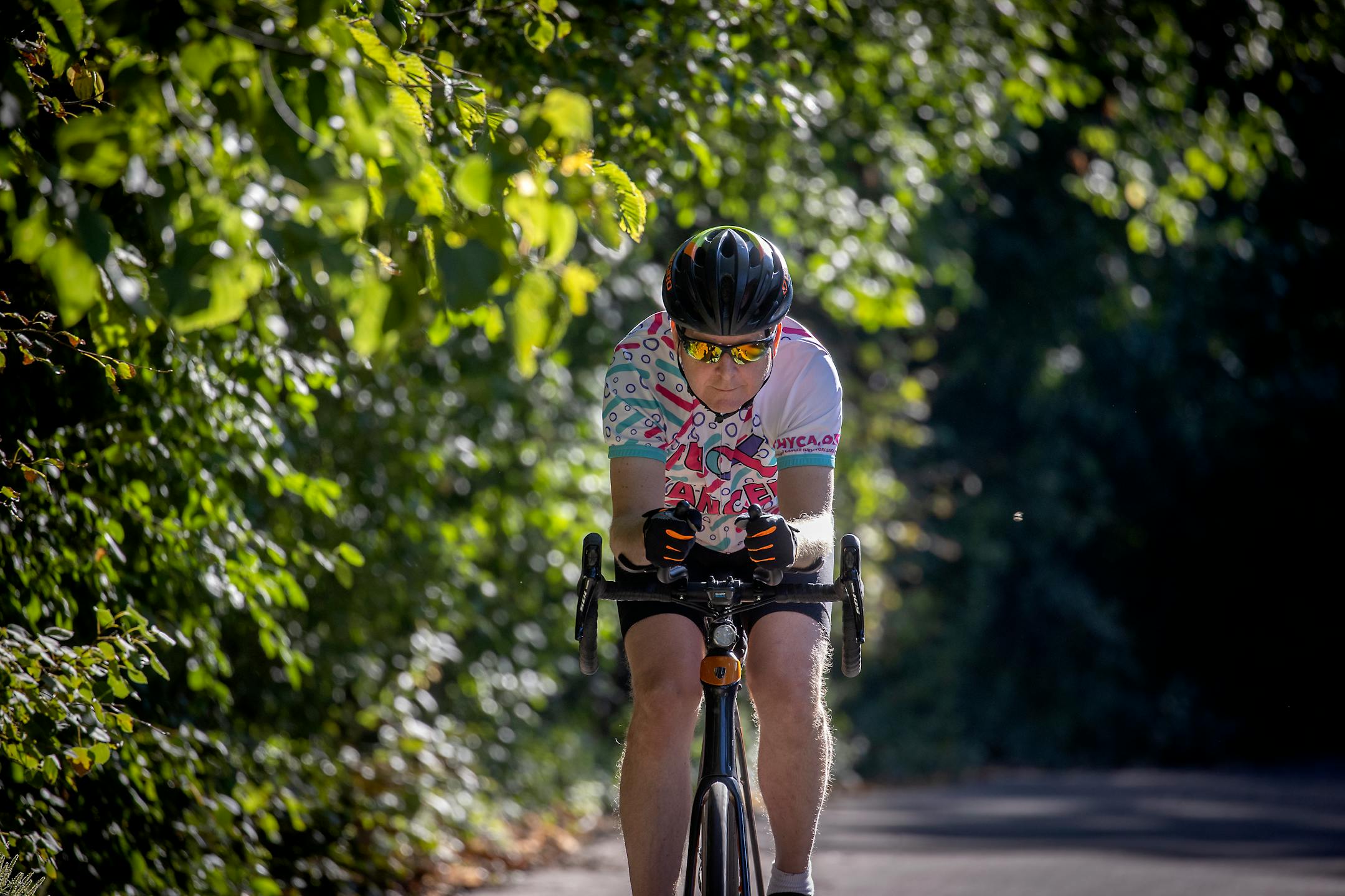 Drayton rode his bike Monday near his home. He has trained daily for his September ride from the North Shore to Iowa.