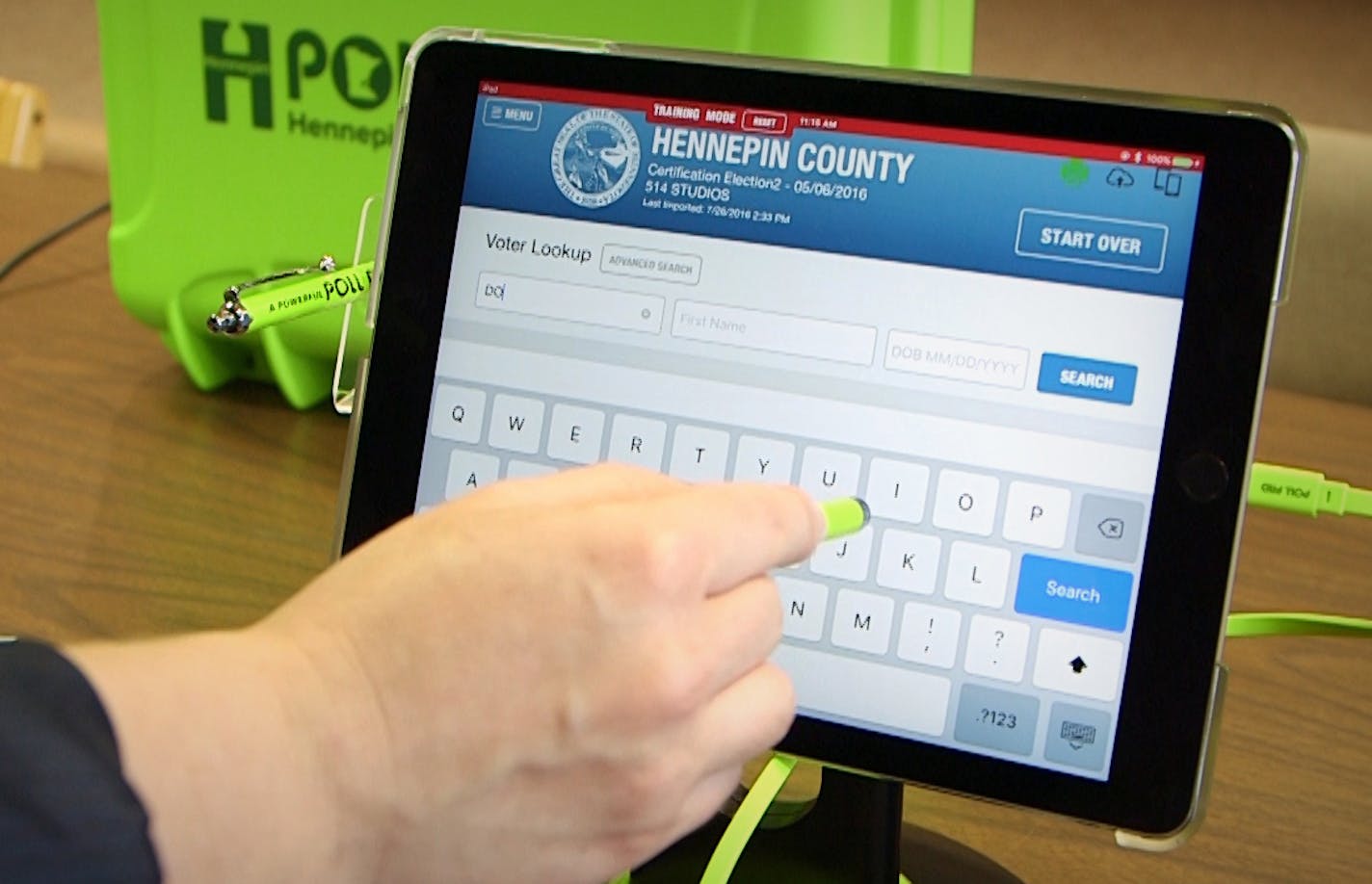 Election Manager for Hennepin County Jinny Gelms demonstrates how to use an e-pollbook, new technology that ditches paper rosters in favor of digital check-in stations. Election officials say it will make voting easier and hope it cuts down on line times at the polls. ] Matt Gillmer/Star Tribune