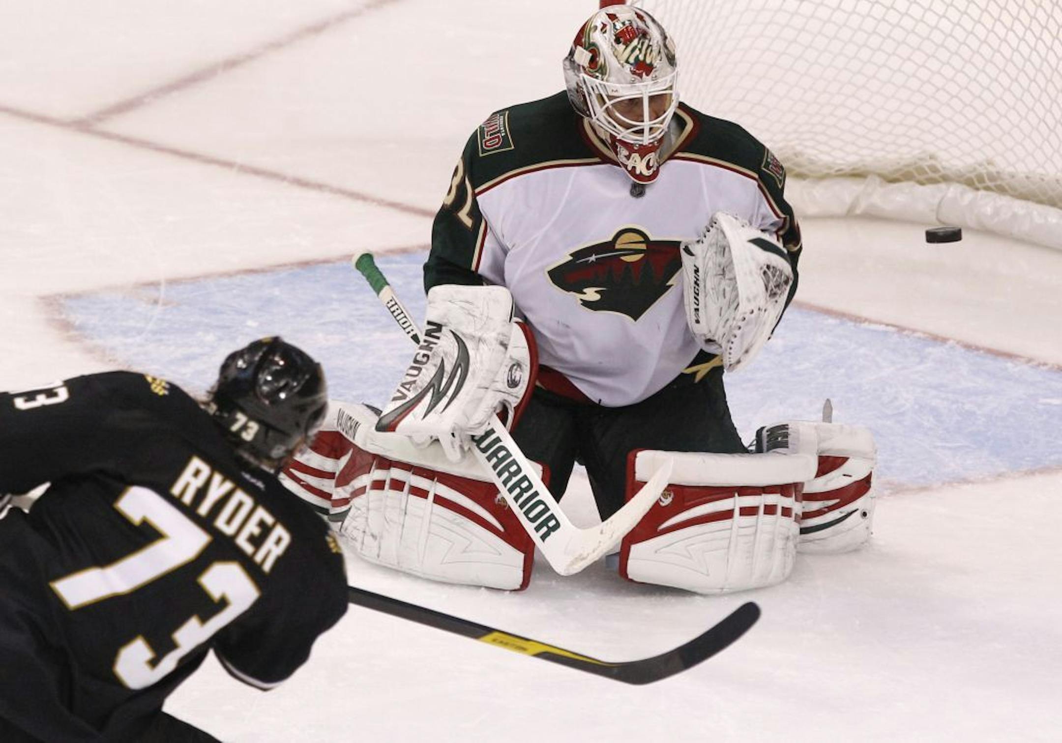 Dallas Stars right wing Michael Ryder's (73) shoot on goal is deflected by Minnesota Wild goalie Niklas Backstrom (32) during the second period of an NHL hockey game in Dallas, Saturday, Feb. 4, 2012.
