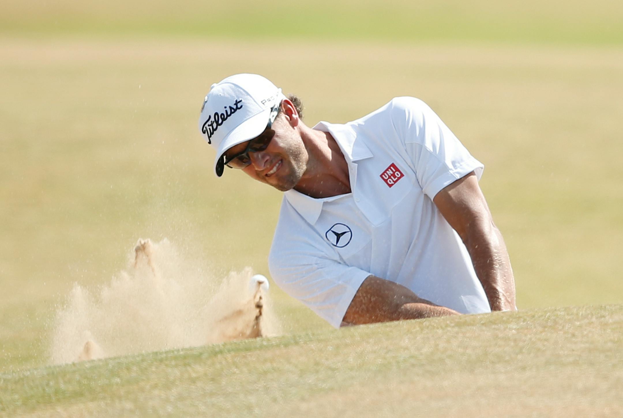 Adam Scott of Australia played out of a bunker onto the second green during the third round of the British Open on Saturday.