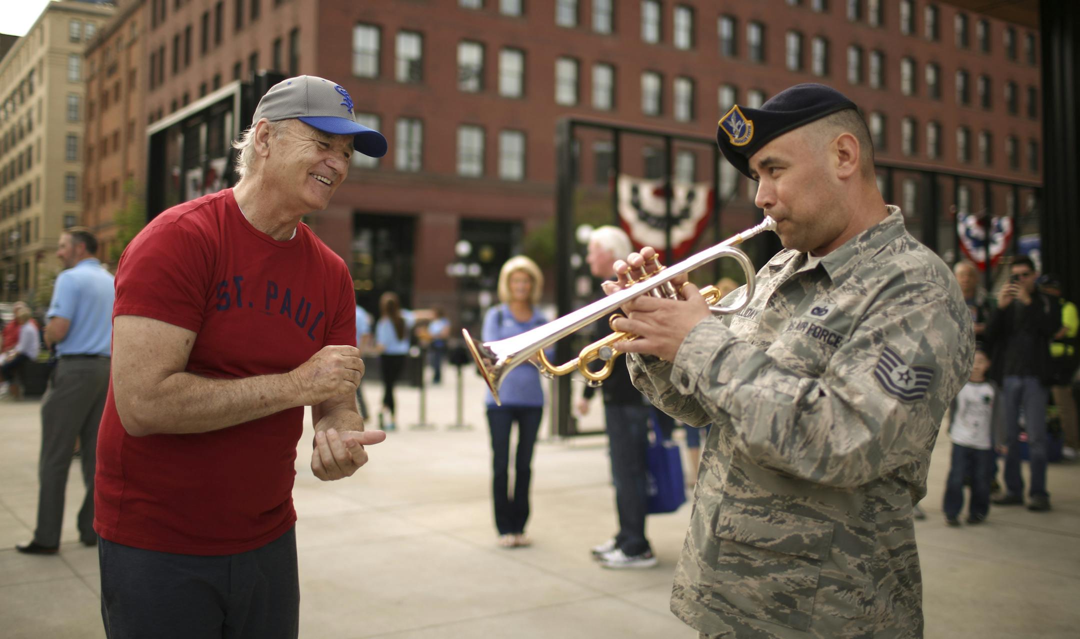 Saints minority owner Bill Murray applauded as Air Force Reservist Tech Sgt. Johnny Holliday as he finished up the last notes of "What a Wonderful World" before the St. Paul Saints home opener Thursday afternoon. ] JEFF WHEELER ï jeff.wheeler@startribune.com The St. Paul Saints faced the Gary SouthShore Railcats in their home opener Thursday night, May 19, 2016, at CHS Field in St. Paul.