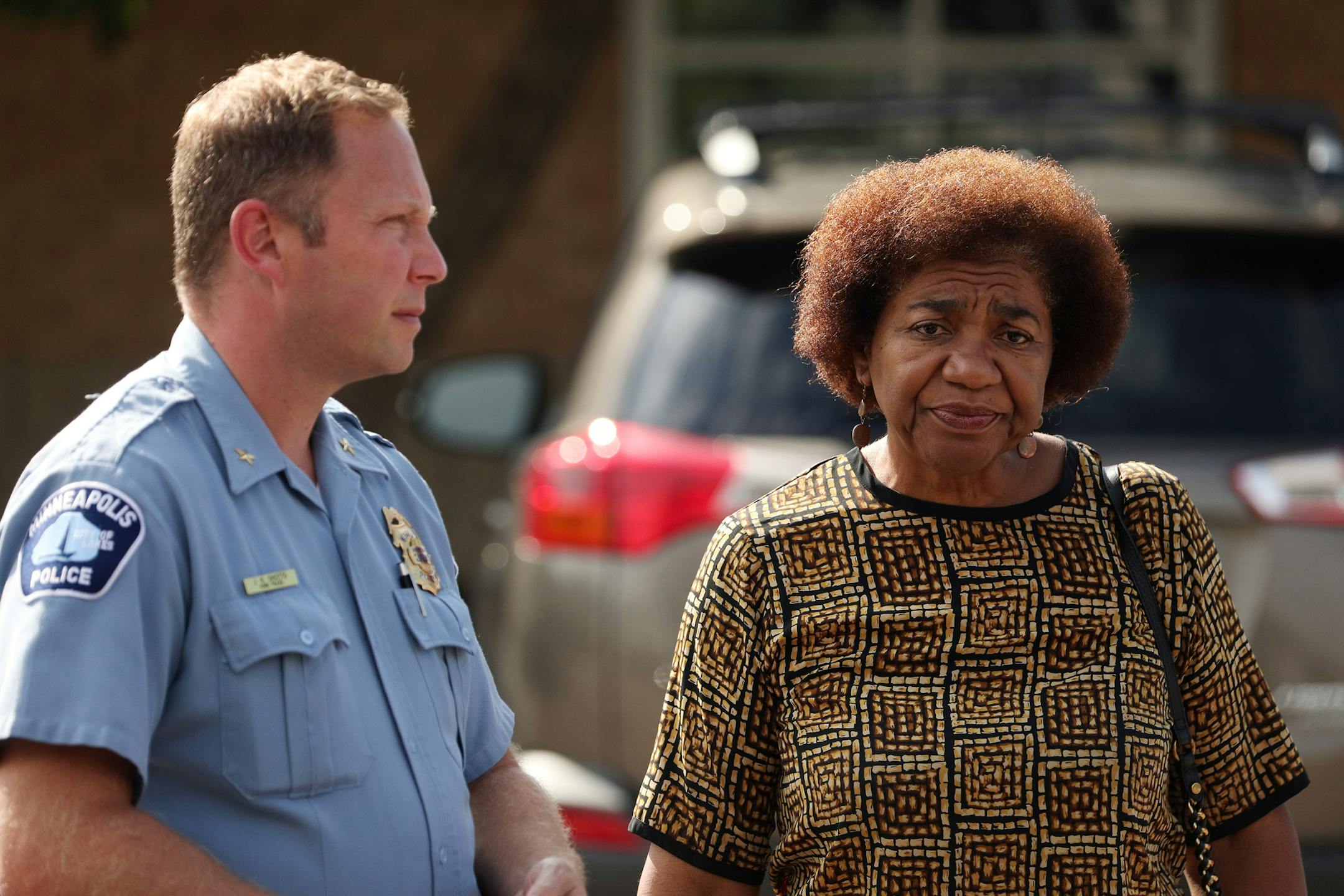 Park Police Chief Jason Ohotto and then-interim Superintendent Mary Merrill talked in July 2018 as they walked from a meeting with the family of the four Somali-American teens who were detained by park police.
