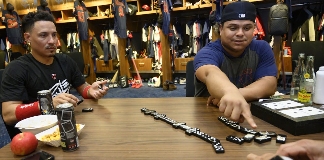 From left, Twins second baseman Luis Arraez, infielder Ronald Torreyes, catcher Willians Astudillo and assistant hitting coach Rudy Hernandez, all from Venezuela, played dominoes in the clubhouse.