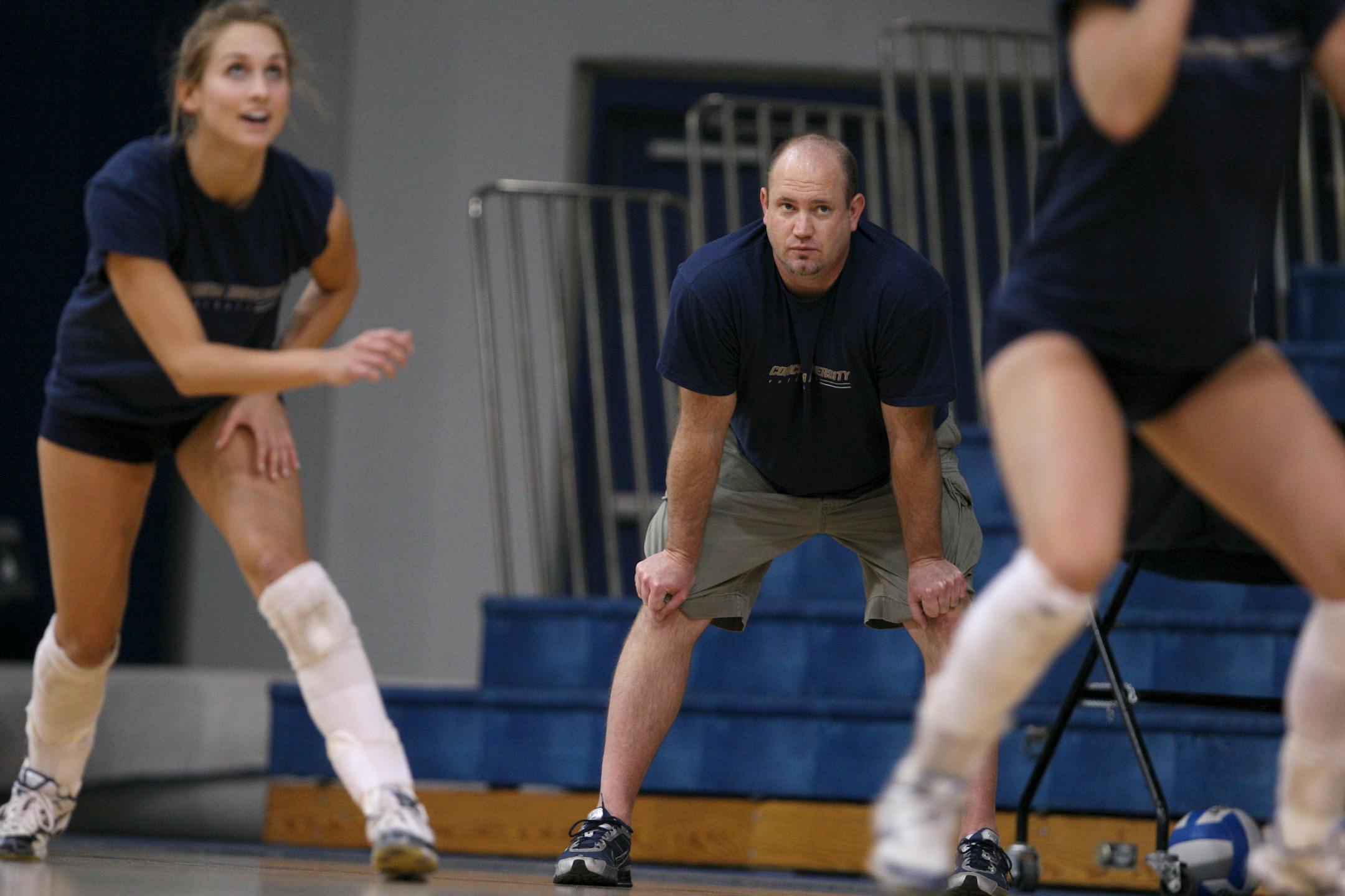 Concordia-St. Paul volleyball coach Brady Starkey watched his team practice Monday afternoon at Ganglehoff Center on the school's campus.