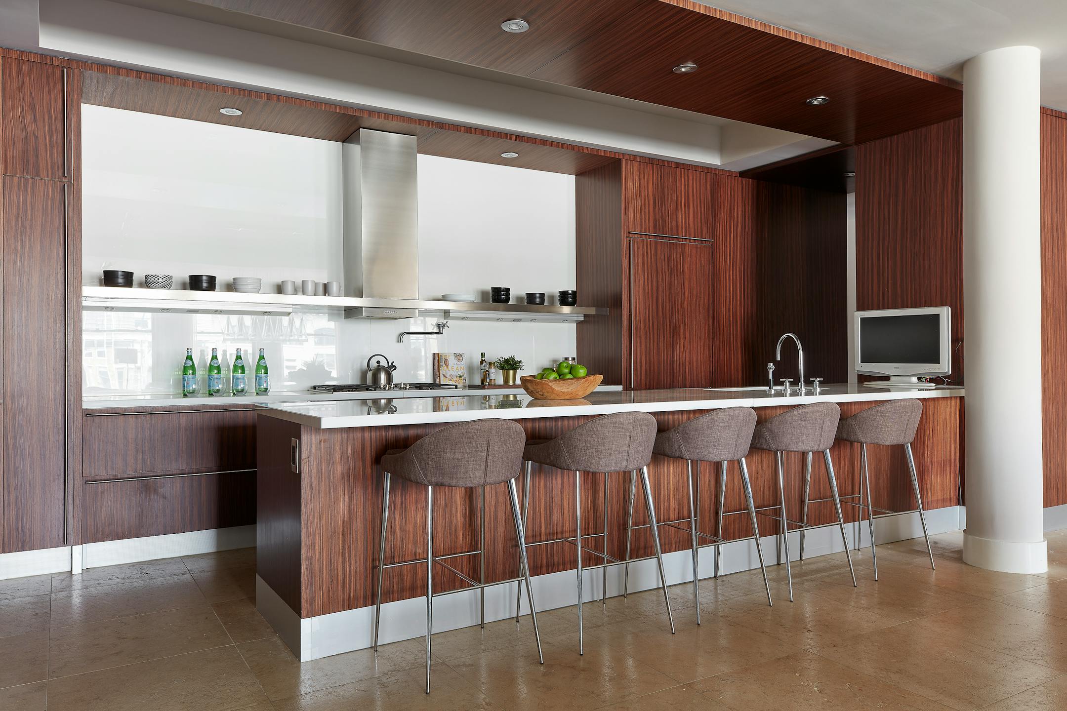 The absence of upper cabinetry is replaced by shelving in this kitchen. (Scott Gabriel Morris/TNS)