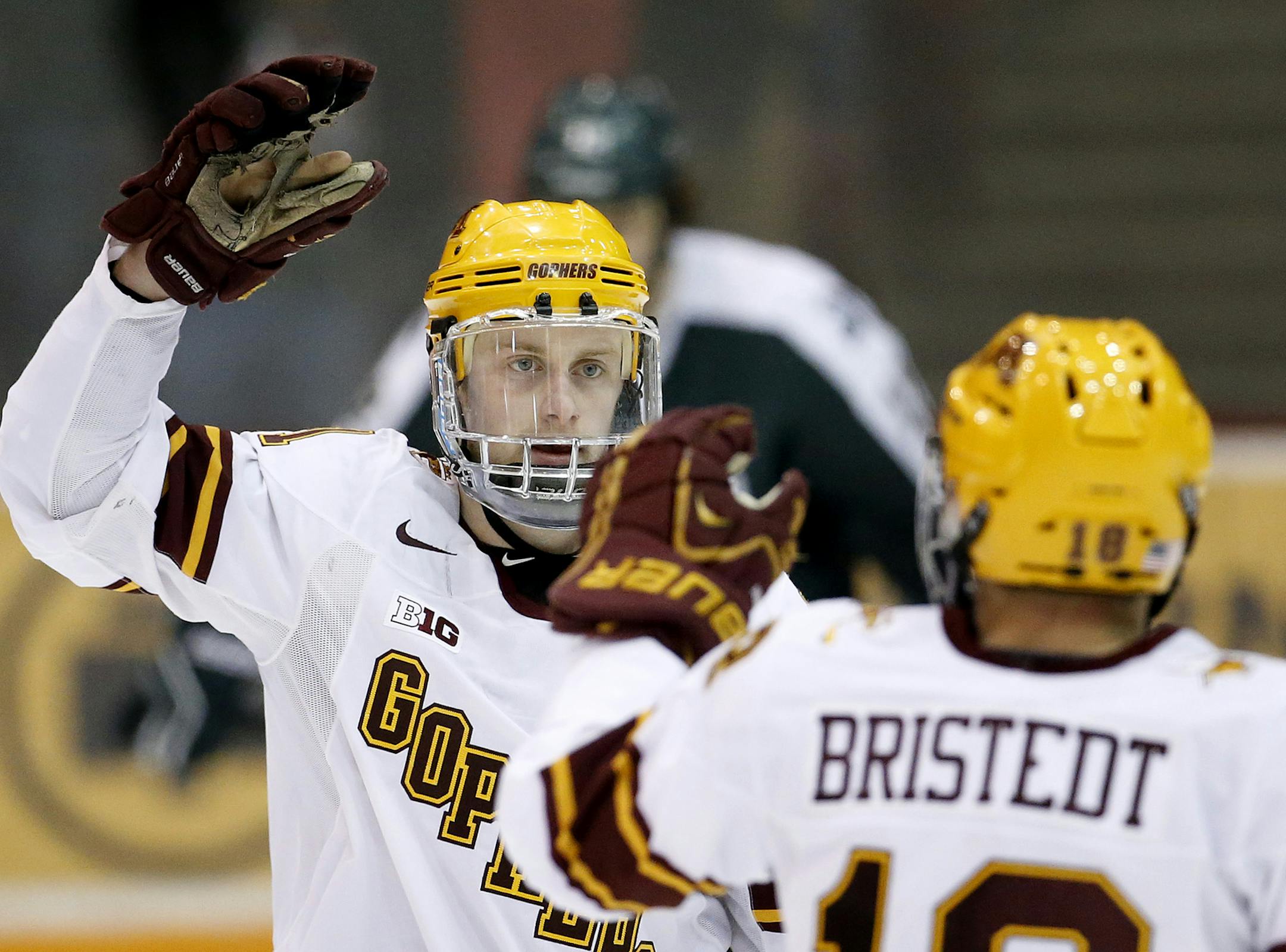 Sam Warning (11) of Minnesota celebrated after scoring a goal in the second period. ] CARLOS GONZALEZ cgonzalez@startribune.com, February 26, 2015, Minneapolis, MN, Minneapolis, MN, Mariucci Arena, NCAA Hockey, Big 10, University of Minnesota Gophers vs. Michigan State Spartans
