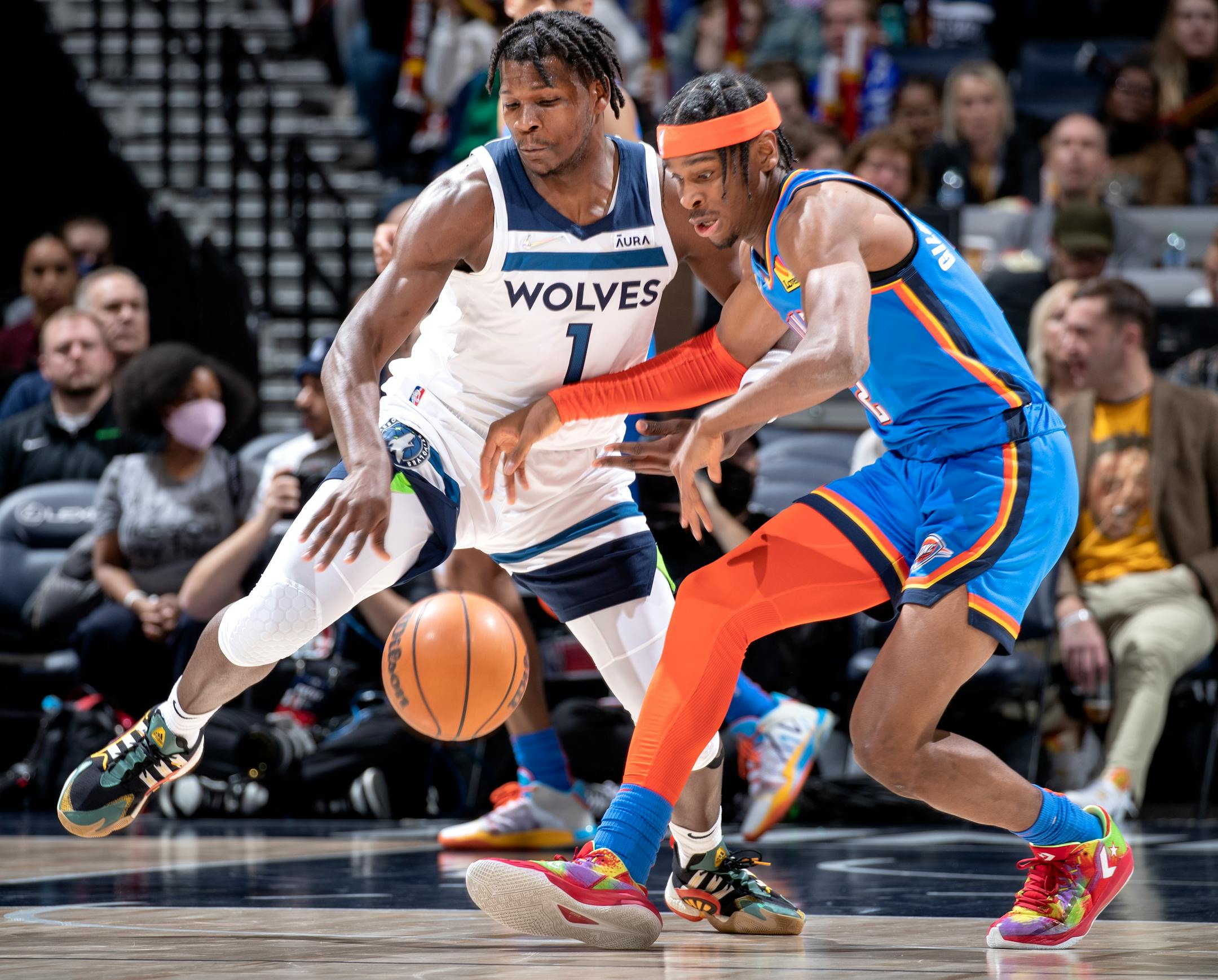 Anthony Edwards (1) of the Minnesota Timberwolves steals the ball from Shai Gilgeous Alexander (2) of the Oklahoma City Thunder.