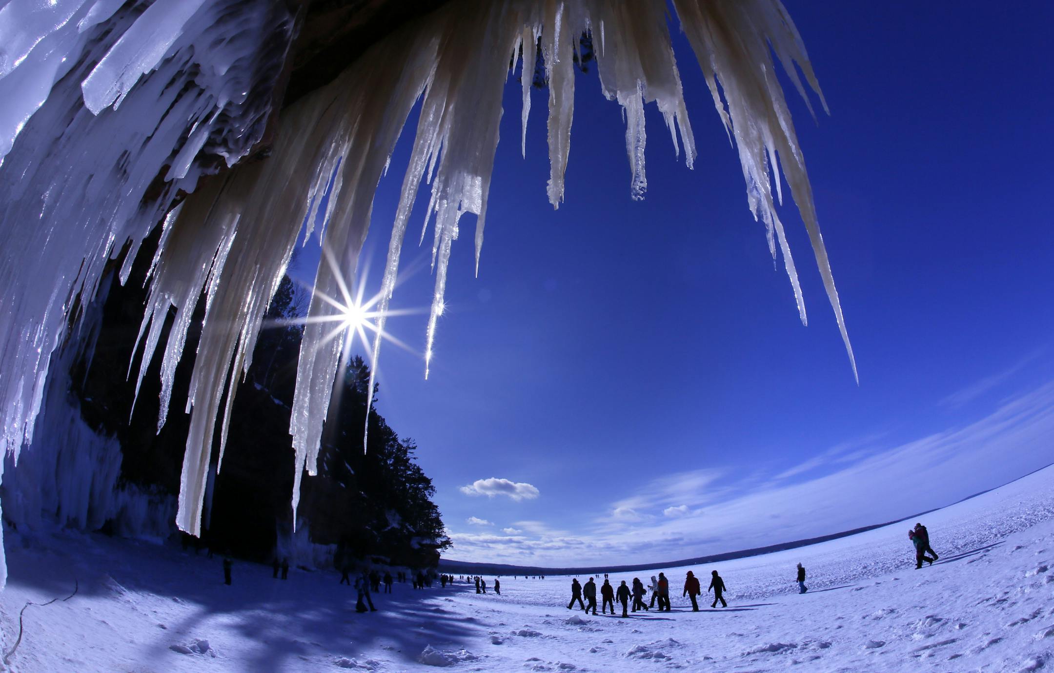 It's been 5 years since the ice has frozen along the south shore of Lake Superior, creating access to the wonders of the Ice Caves of the Apostle Islands National Lakeshore. Over the weekend over 8,000 people made the pilgrimage, a mile walk along the frozen shore, to witness and photograph the crystal wonders of the caves. ] BRIAN PETERSON ï brianp@startribune.com Cornucopia, WI 02/02/2014 ORG XMIT: MIN1402030840130611