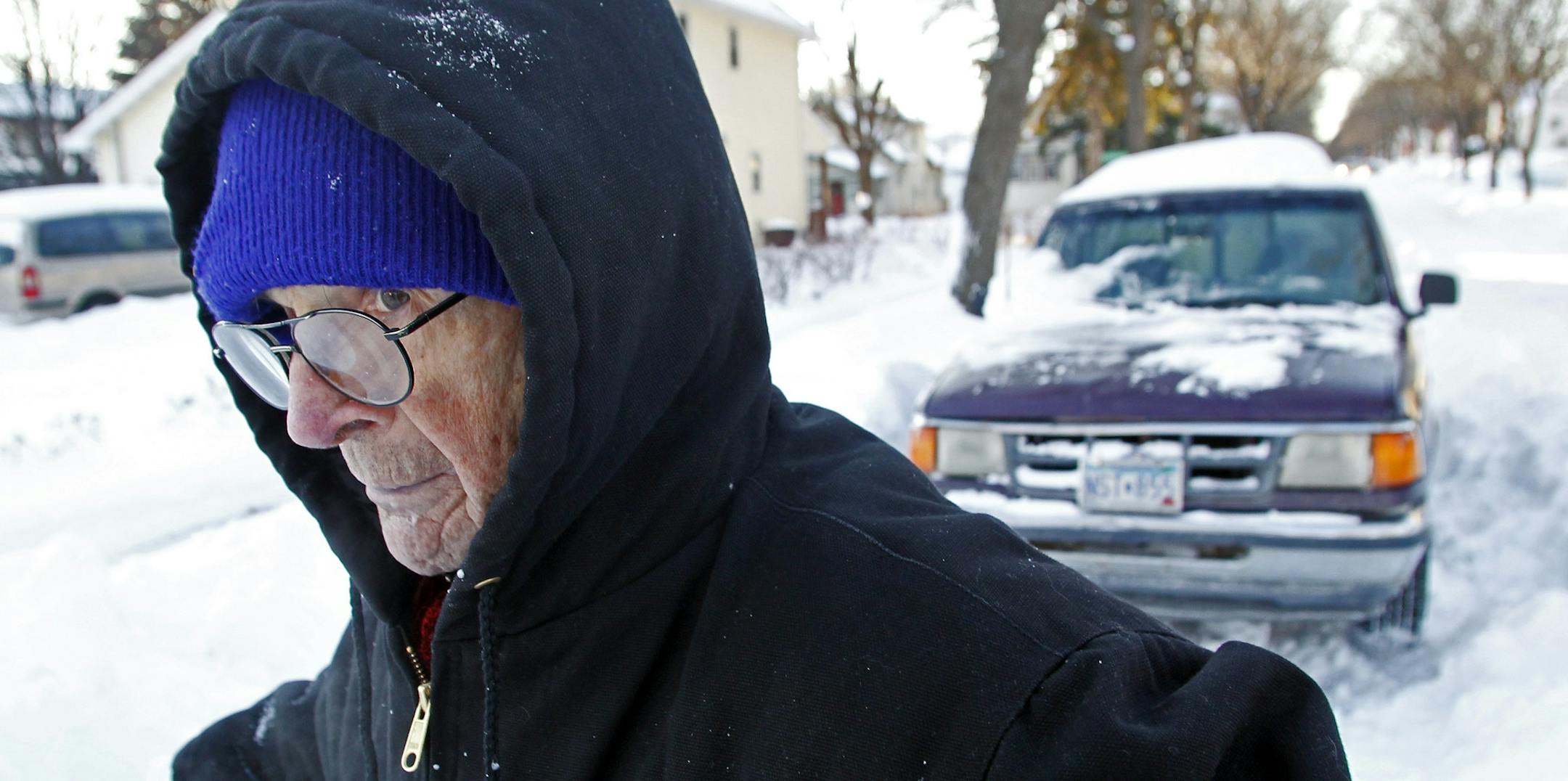 Larry Rankin spent hours Sunday digging his vehicle out of the snow after he was plowed in along Queen Avenue N. Rankin said he likes snow; "I just don't like to shovel." He was one of a multitude of Minnesotans digging, plowing and blowing their way out from under Saturday's ripsnorter of a storm.
