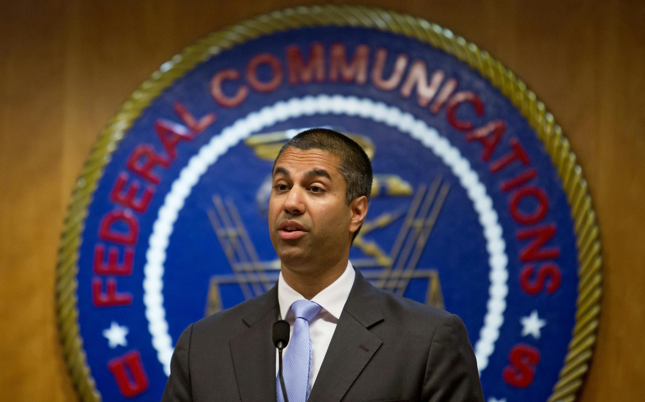 FILE -- Ajit Pai, chairman of the Federal Communications Commission, at the federal agency's headquarters in Washington, June 23, 2017. The Federal Communications Commission has voted to eliminate restrictions known as the media cross-ownership ban, and to increase the number of TV stations a company could own in a local market. (Eric Thayer/The New York Times)