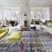 Home of the Month - White living room with lots of windows and colorful rug and accents, Designed by Peterssen/Keller, Credit Andrea Rugg