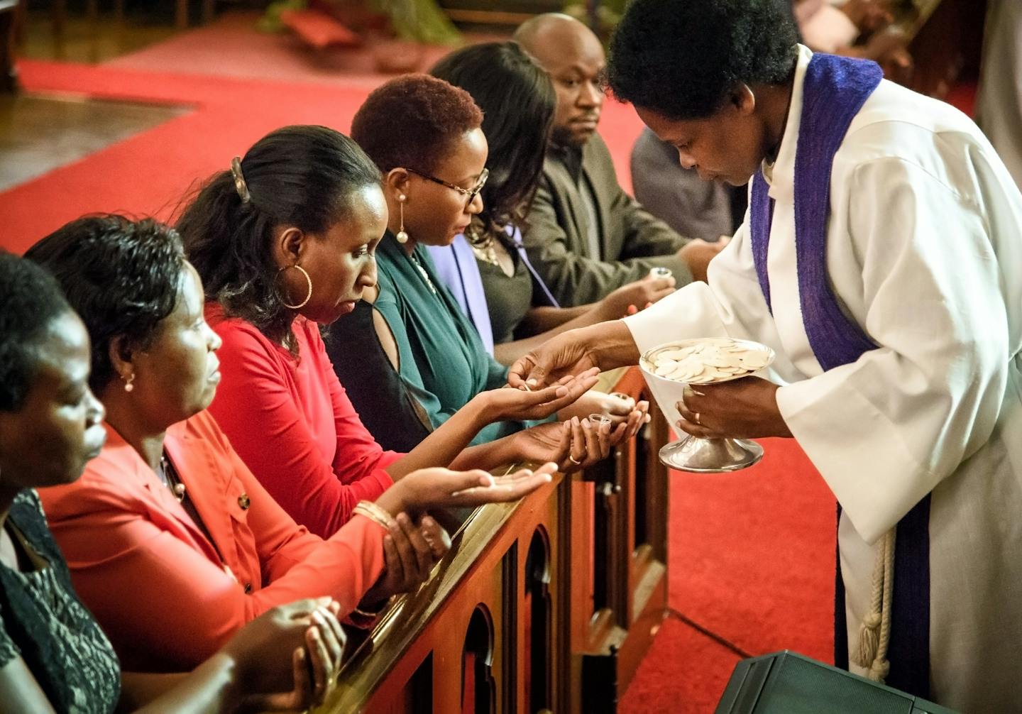 Kaanasia Msangi, a Tanzanian student studying to be a minister at Luther seminary, served communion. ] GLEN STUBBE &#xef; glen.stubbe@startribune.com Sunday, October 8, 2017 On Sundays at 2, the Minnesota Swahili Christian Congregation meets at Holy Trinity church, Minneapolis. The service and hymnals are in Swahili. The choir is accompanied by an electric keyboard and electric guitar. After the service, parishioners head to the social hall. The Pastor is Andrea Mwalilino.