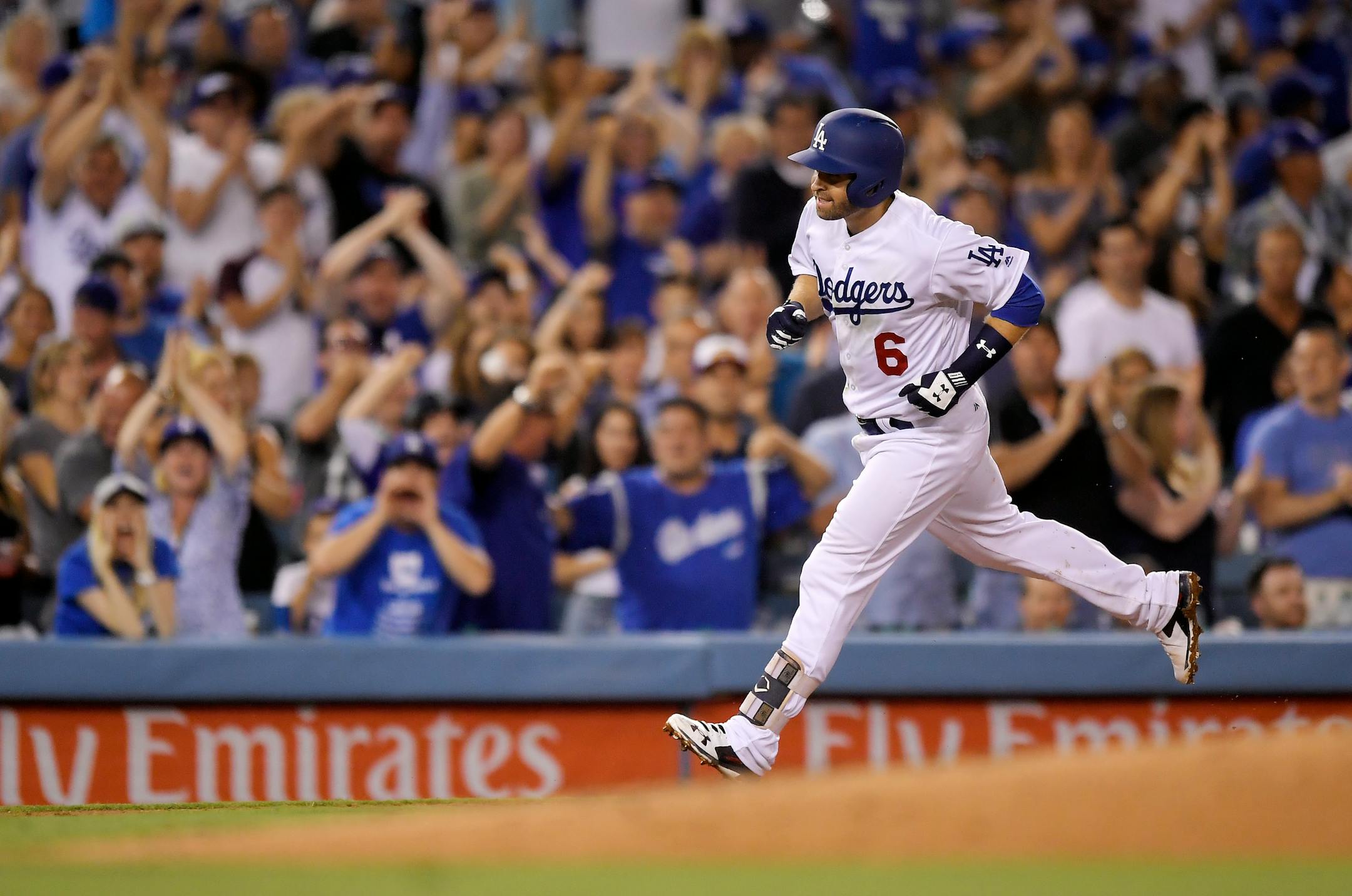 Los Angeles Dodgers' Brian Dozier rounds third after hitting a solo home run during the fifth inning against the Los Angeles Dodgers in a baseball game Wednesday, Aug. 1, 2018, in Los Angeles. (AP Photo/Mark J. Terrill)
