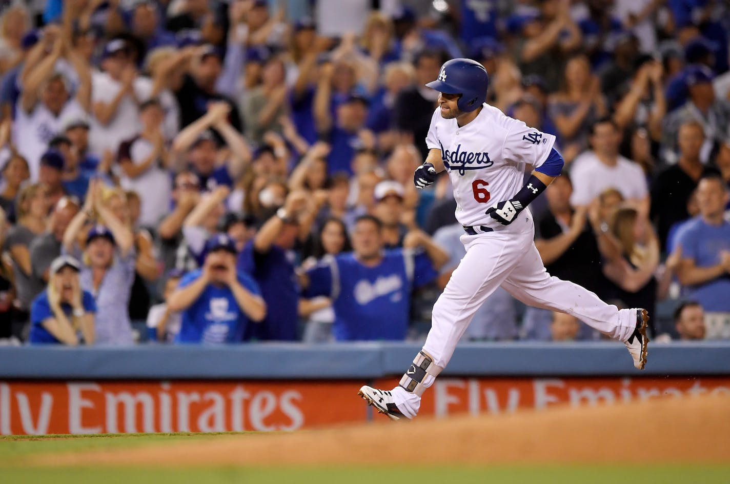 Los Angeles Dodgers' Brian Dozier rounds third after hitting a solo home run during the fifth inning against the Los Angeles Dodgers in a baseball game Wednesday, Aug. 1, 2018, in Los Angeles. (AP Photo/Mark J. Terrill)