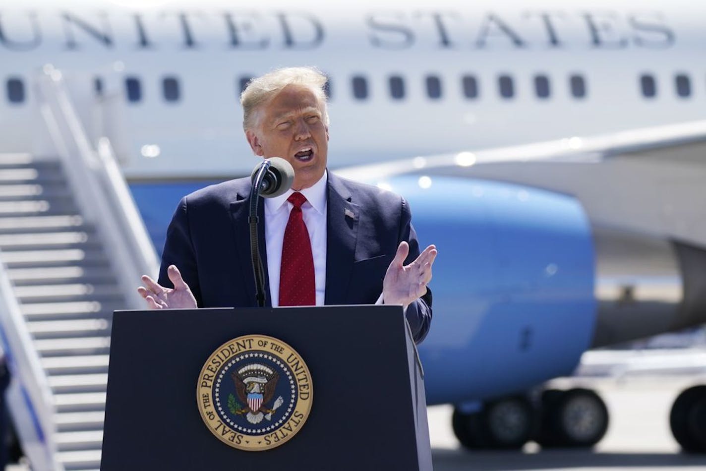 President Donald Trump speaks to a crowd of supporters at Minneapolis-Saint Paul International Airport, Monday, Aug. 17, 2020, in Minneapolis.