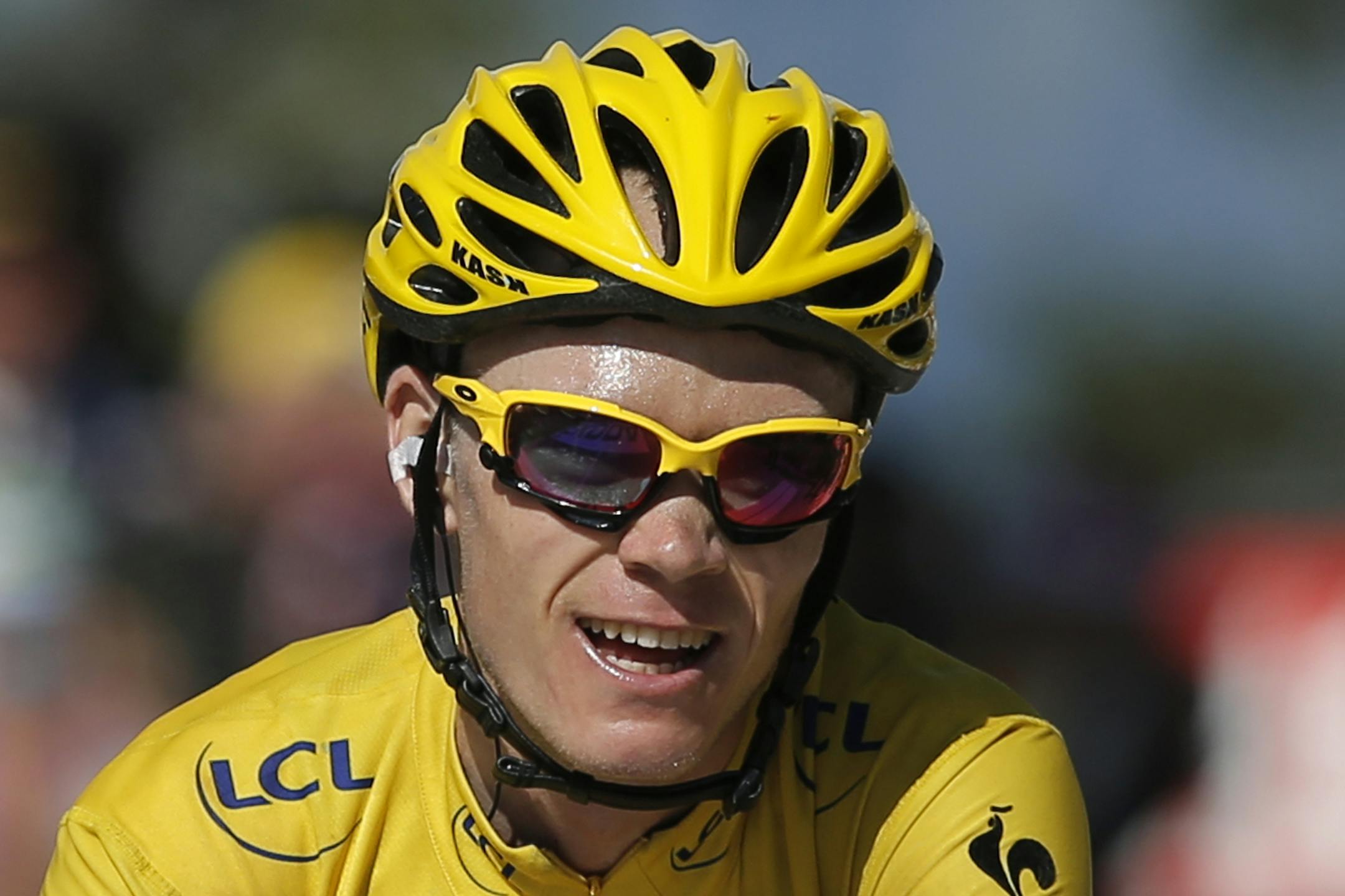 Christopher Froome of Great Britain, wearing the overall leader's yellow jersey, was all smiles as he crossed the finish line the 20th stage of the Tour de France on Saturday in Annecy-Semnoz, France. Froome kept his lead and all but secured the title leading into Sunday's final stage.