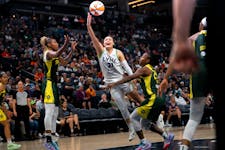 Lynx guard Kayla McBride shoots a basket in the first overtime of the home opener game against the Seattle Storm at Target Arena on Friday.