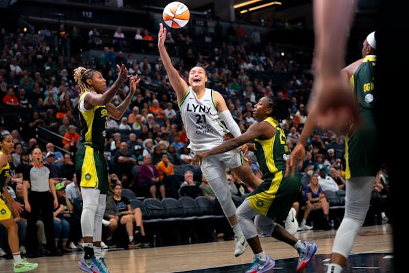 Lynx guard Kayla McBride shoots a basket in the first overtime of the home opener against the Seattle Storm at Target Center on Friday.