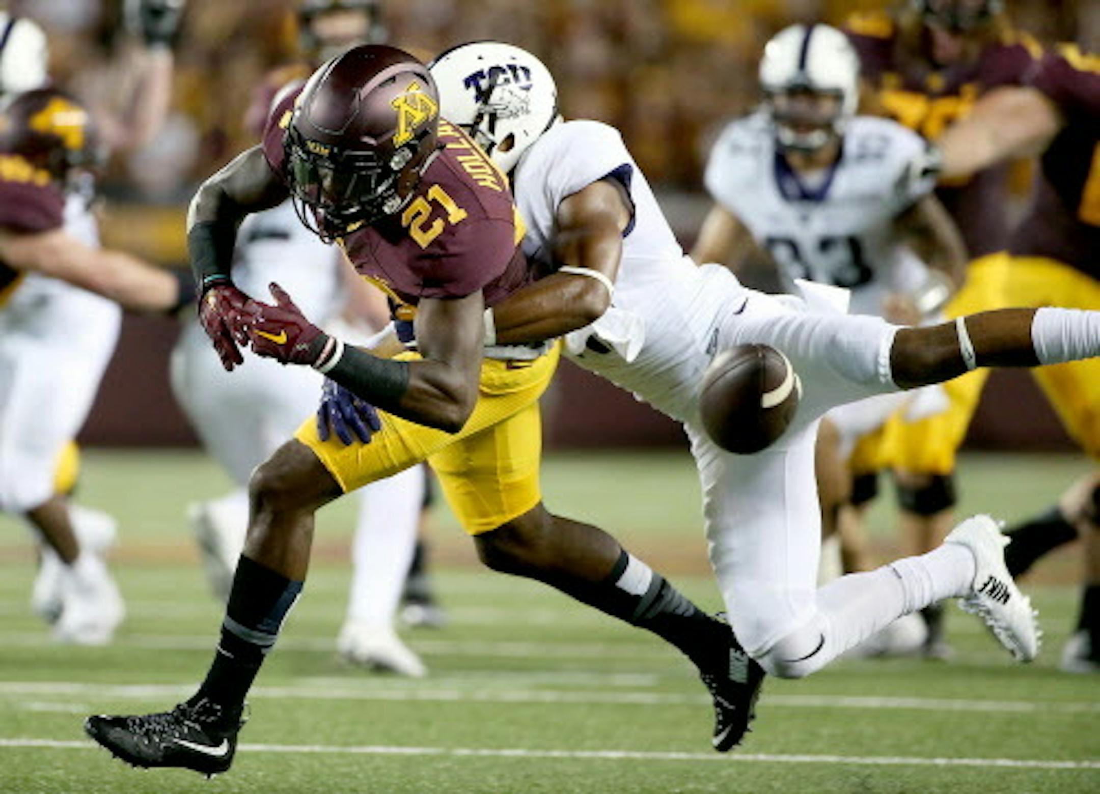 Minnesota Gophers wide receiver Melvin Holland Jr. missed a grab as he was being defended by TCU's safety Nick Orr as  the Gophers took on TCU at TCF Stadium, Thursday, September 3, 2015 in Minneapolis, MN.   ] (ELIZABETH FLORES/STAR TRIBUNE) ELIZABETH FLORES ' eflores@startribune.com