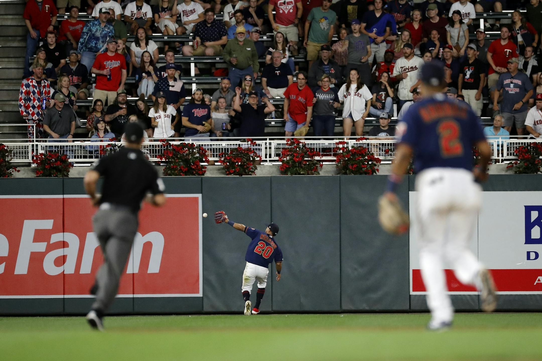 Minnesota Twins left fielder Eddie Rosario (20) loses a fly ball.