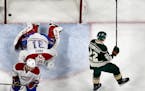 Nino Niederreiter (22) celebrated after shooting the puck past Montreal goalie Carey Price (31) for a goal in the third period.