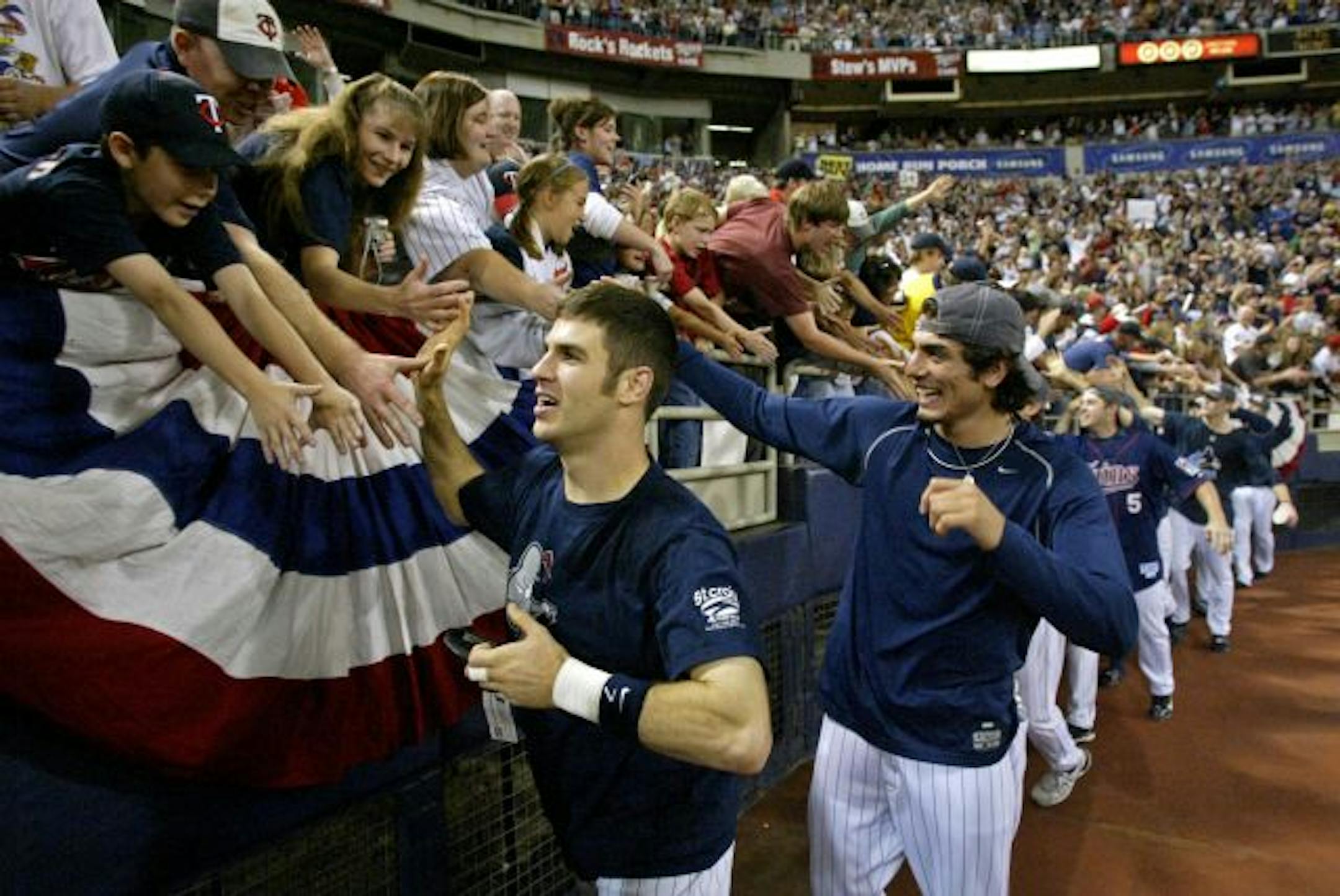 Joe Mauer leads a victory lap around the Metrodome.