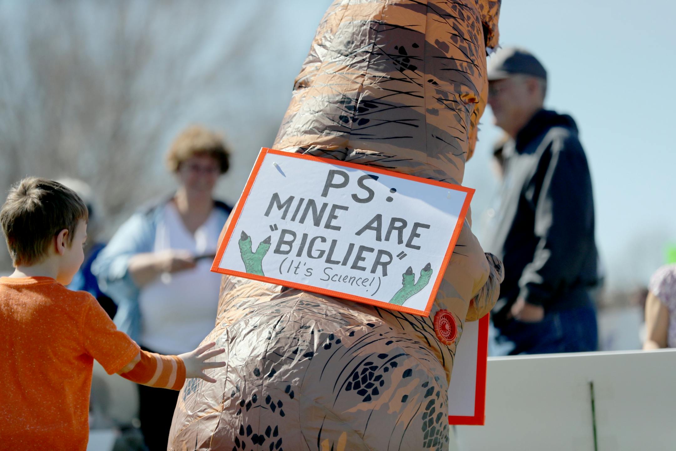 March for Science moved from the start at Cathedral Hill Park to State Capitol, with an estimated 10,000 or more joining to champion the role of science in American life. Here, a young boy reaches out to touch an inflatable dinosaur during the March for Science near Cathedral Hill Park Saturday, April 22, 2017, in St. Paul, MN.