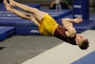 Minnesota's Shane Wiskus competes in the floor exercise during the NCAA men's gymnastics championships Friday