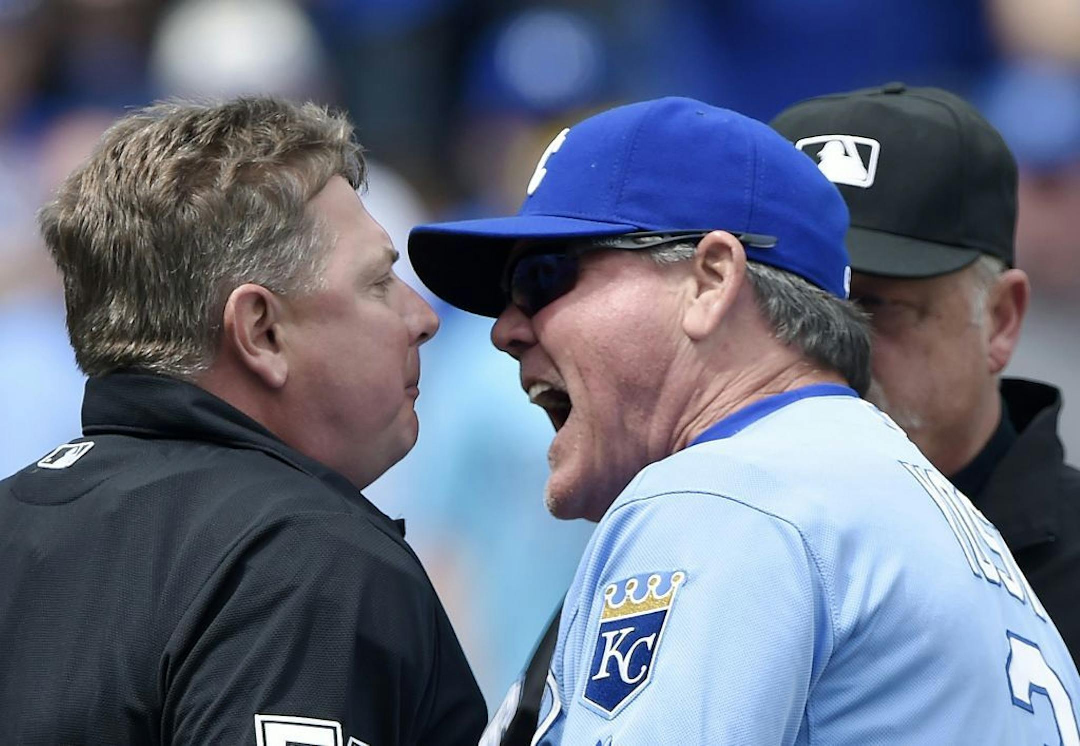 Kansas City Royals manager Ned Yost argues with home plate umpire Greg Gibson after being ejected following a hit by pitch of Kansas City Royals' Lorenzo Cain during the first inning on Sunday, April 19, 2015, at Kauffman Stadium in Kansas City, Mo.