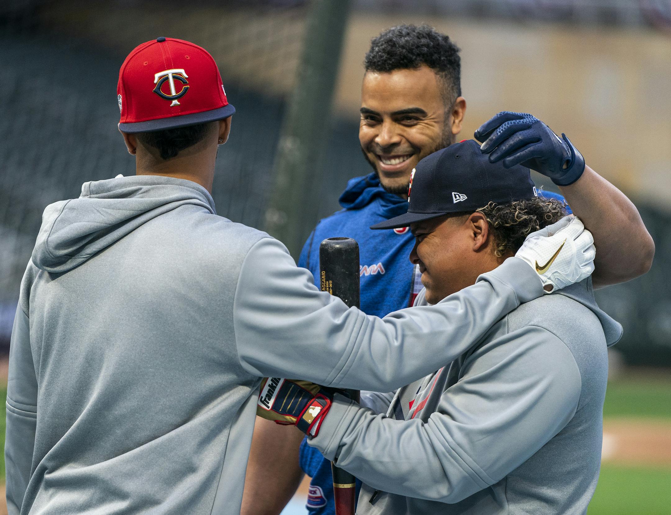 Minnesota Twins right fielder Eddie Rosario (20), from left, Minnesota Twins designated hitter Nelson Cruz (23) and Minnesota Twins infielder Willians Astudillo shared a jovial moment during the Twins workout. ] LEILA NAVIDI • leila.navidi@startribune.com BACKGROUND INFORMATION: Workout day and media availability for the Twins and the Yankees ahead of Game 3 of their ALDS matchup at Target Field in Minneapolis on Sunday, October 6, 2019.
