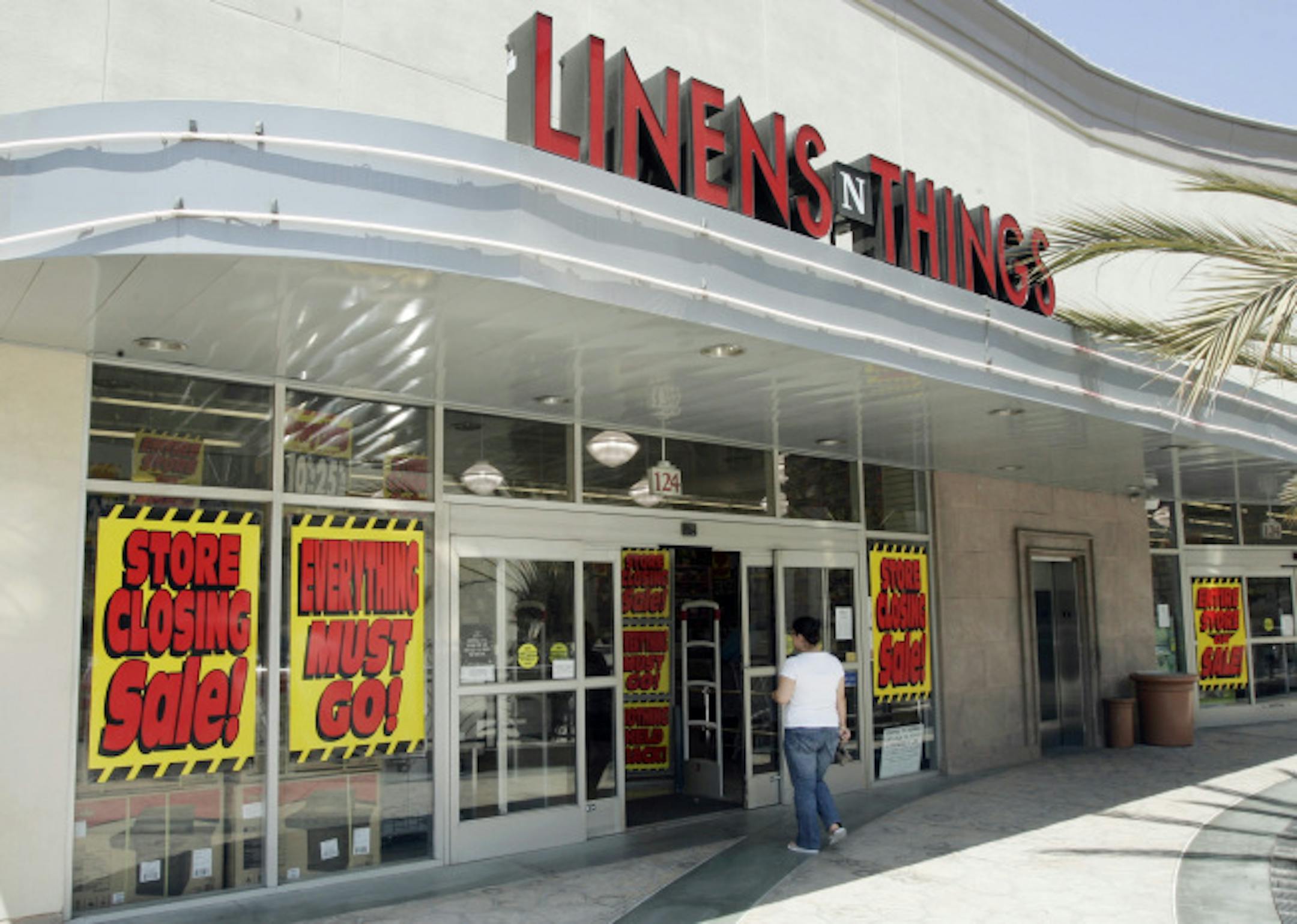 In this May 31, 2008 file photo, a woman enters a Linens 'N Things store in Glendale, Calif. Linens 'N Things and other other names vanished this year, victims of the economy, the financial meltdown or other factors. Experts say 2009 could mark the end of even more brands as the now year-long recession puts more struggling companies on life-support.