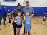 Paul Blume (left) and his daughter, Beatrice, alongside Lou Raguse and his daughter, Violet, after their team won a championship.